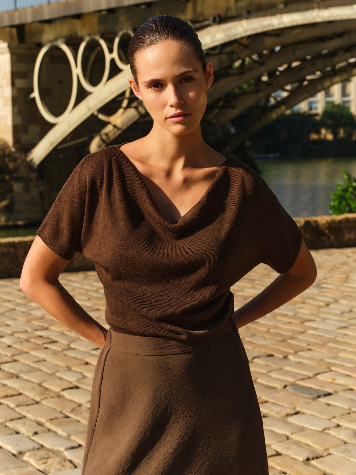 Knitted top with short sleeves and draped neckline