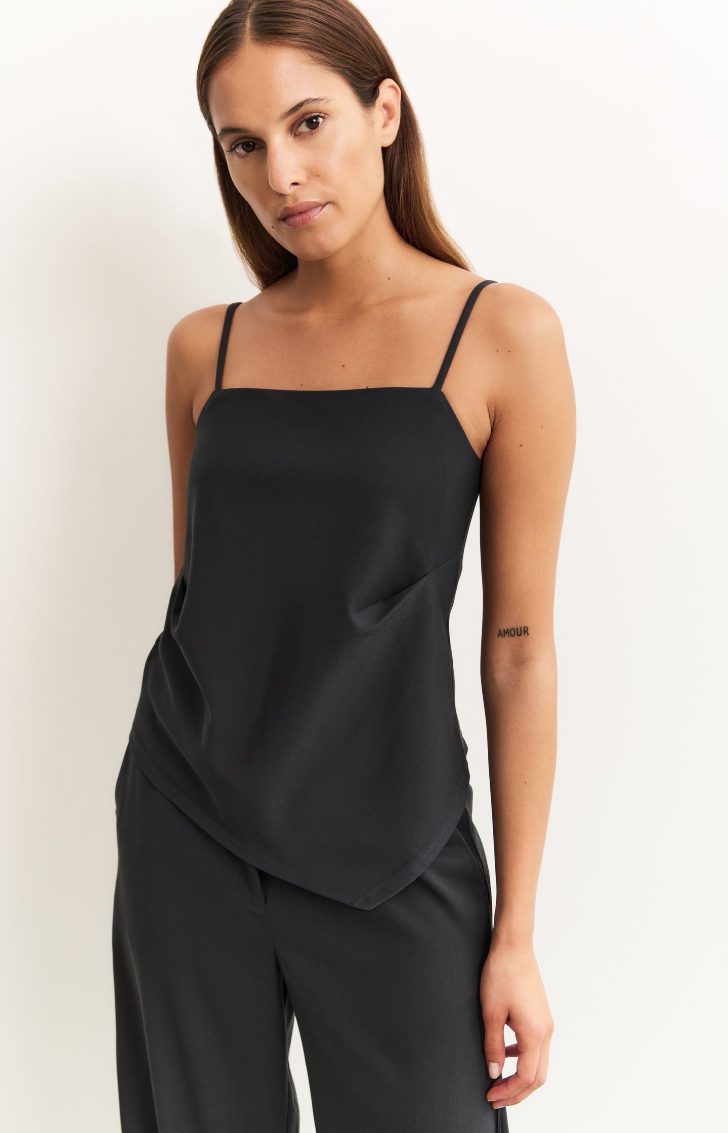 Asymmetric strappy top with fitted silhouette