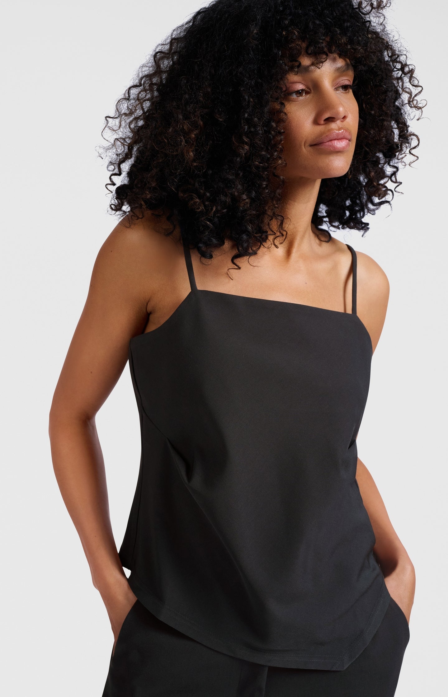 Asymmetric strappy top with fitted silhouette