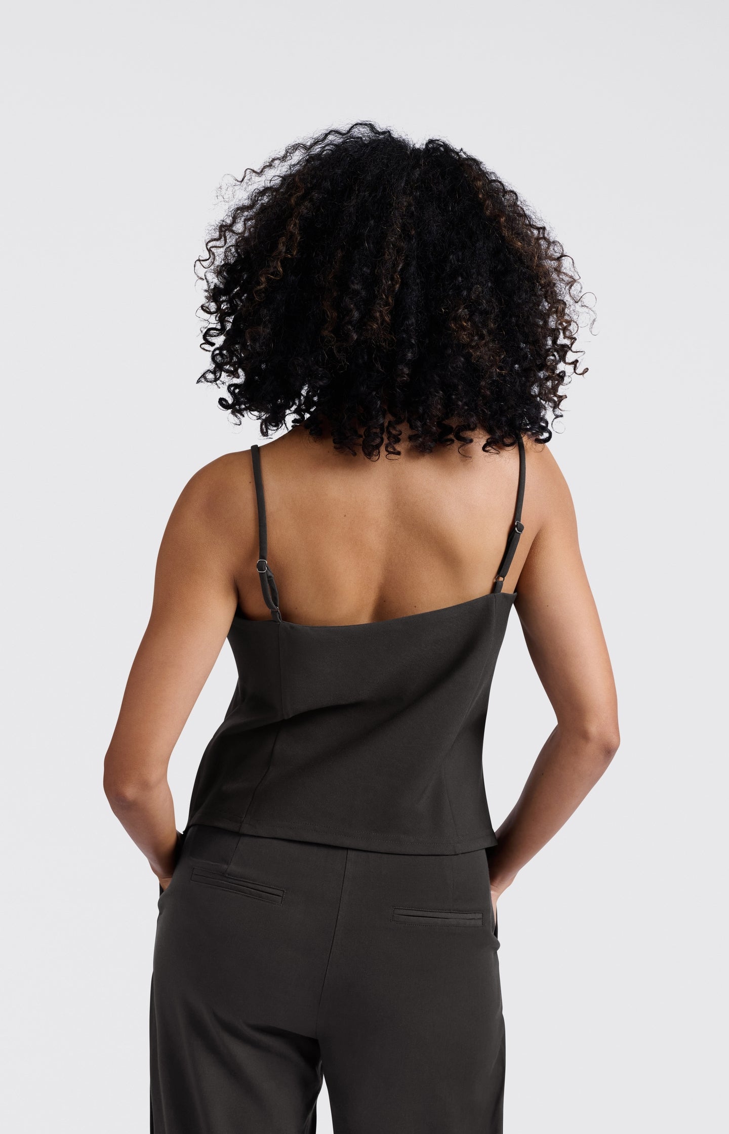 Asymmetric strappy top with fitted silhouette