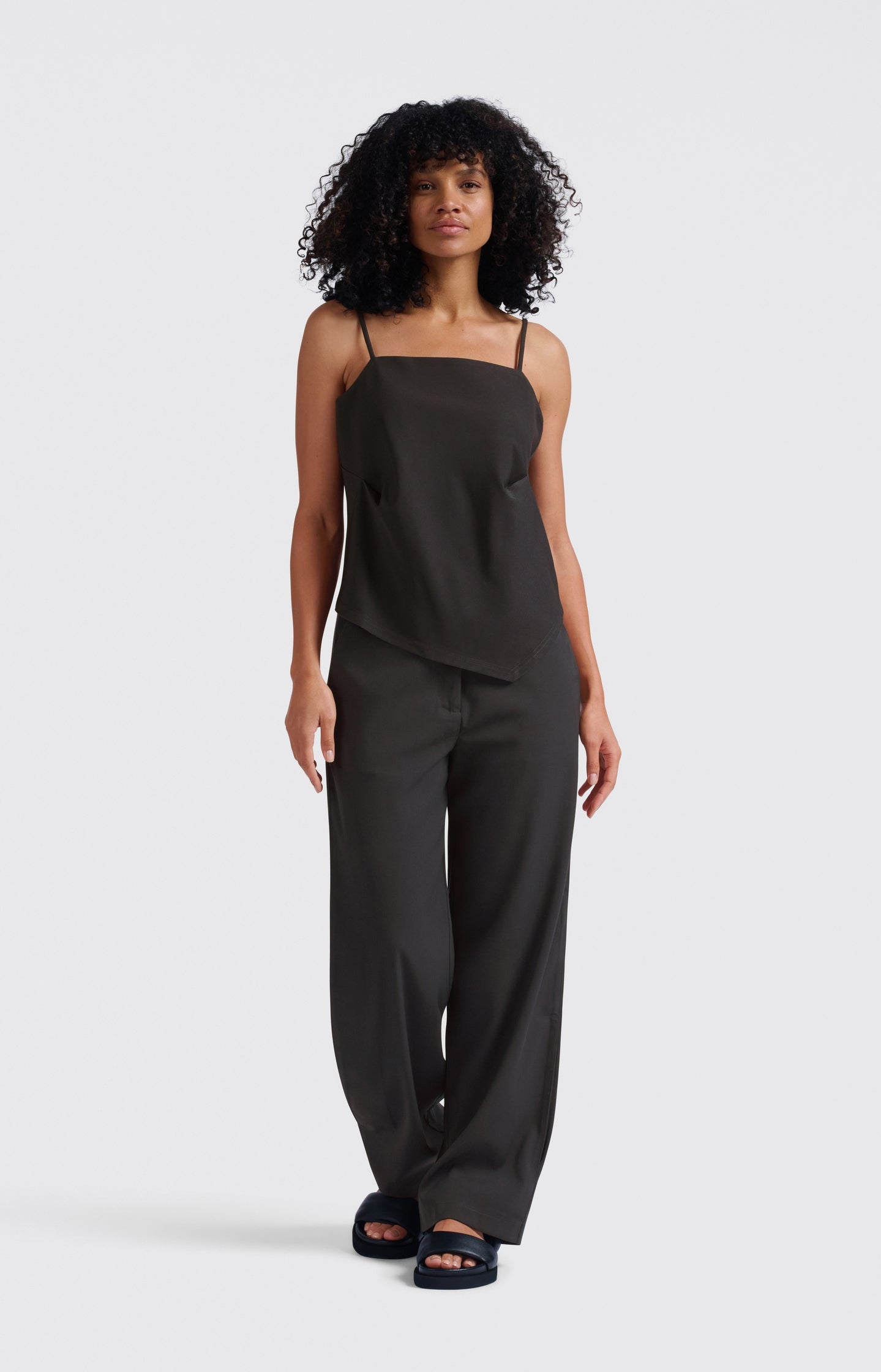 Asymmetric strappy top with fitted silhouette