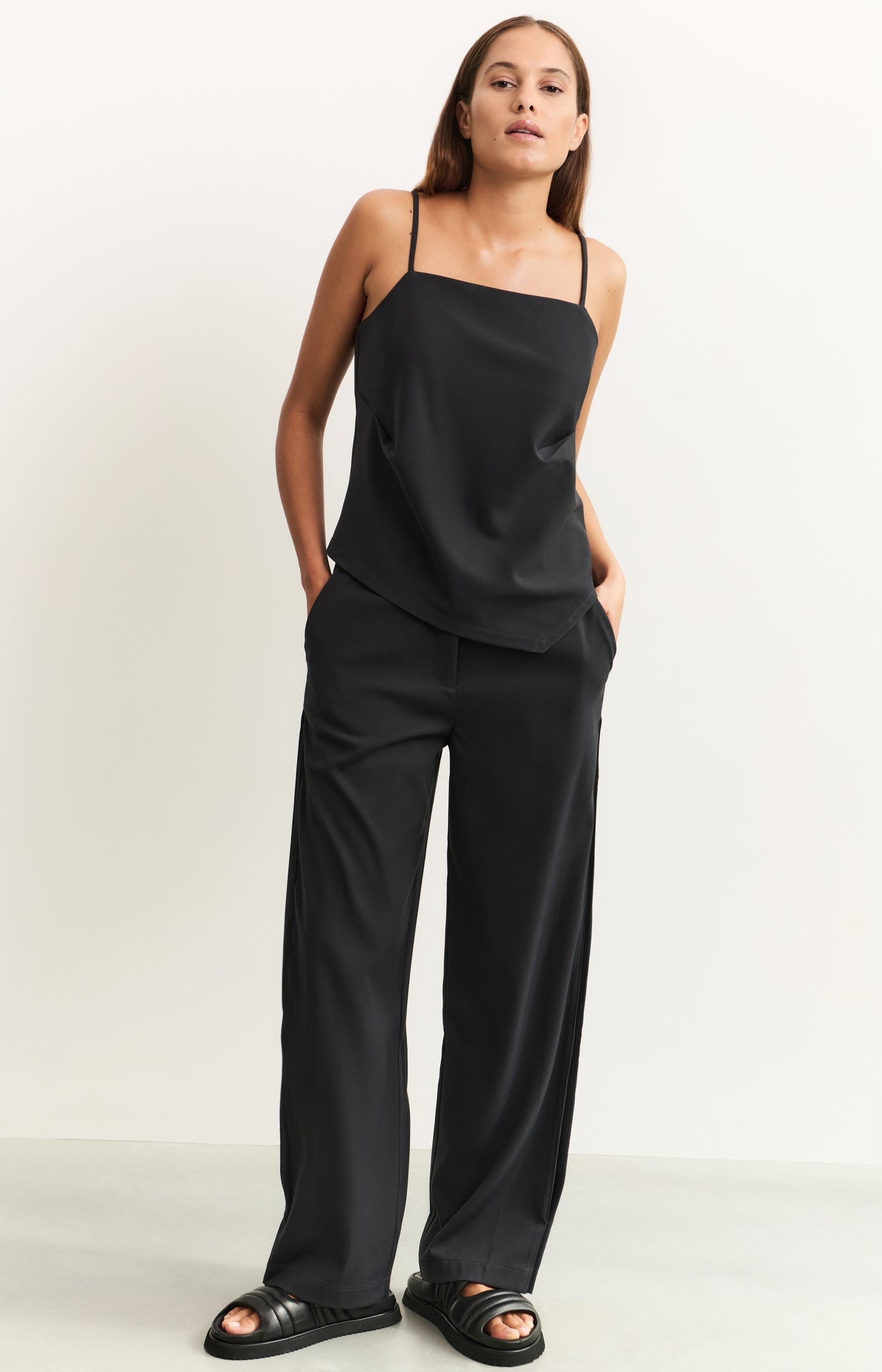 Asymmetric strappy top with fitted silhouette