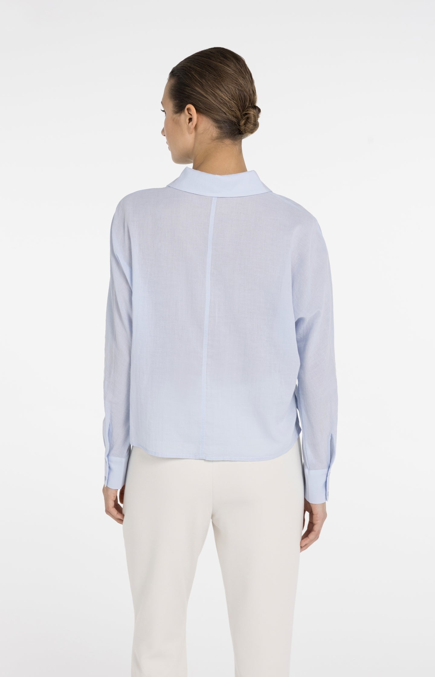 Blouse with angled seams and button details