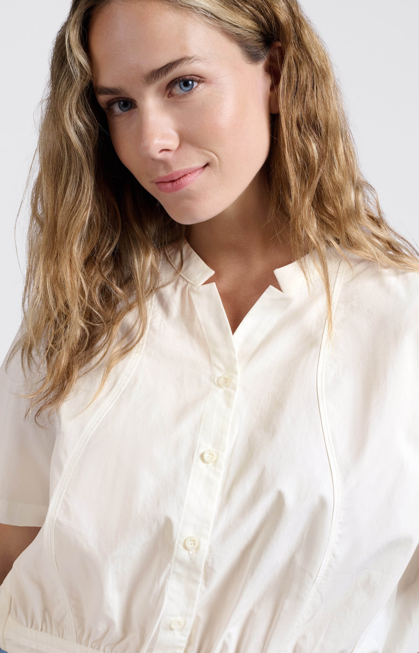 Blouse with drawcord and refined stitching details