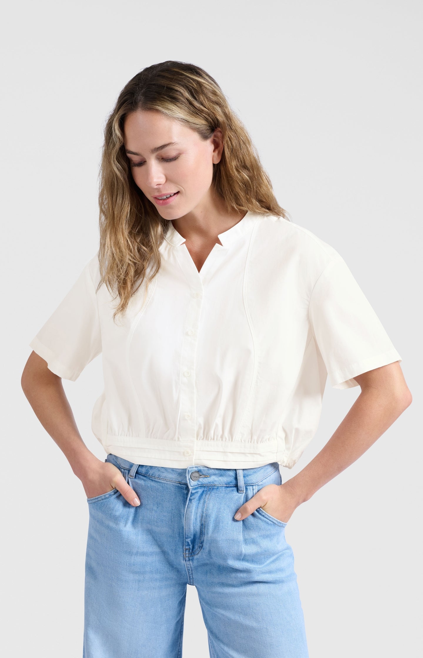 Blouse with drawcord and refined stitching details