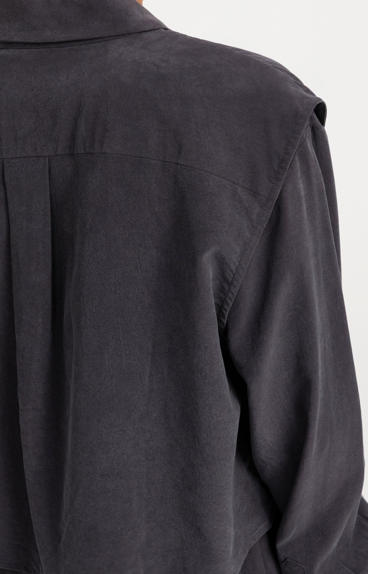 Blouse with layered gilet and pleated details