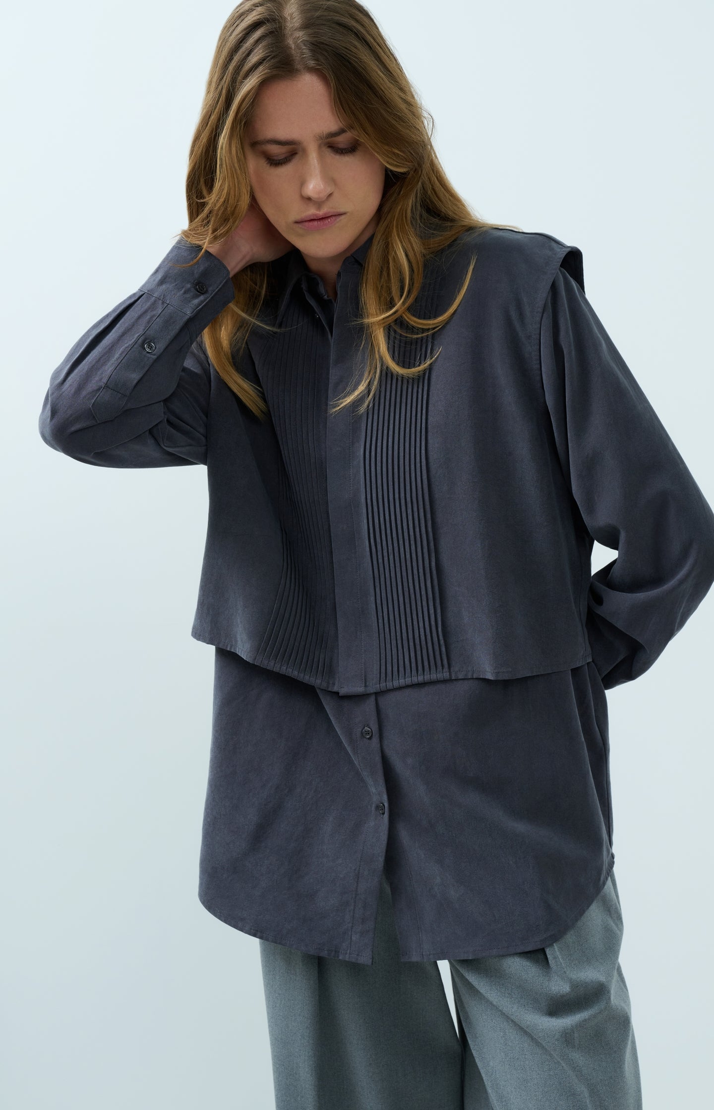 Blouse with layered gilet and pleated details