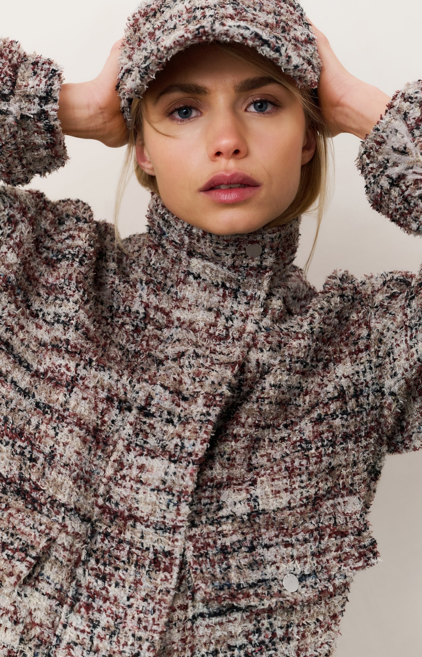 Bouclé jacket with fringes and stand-up collar