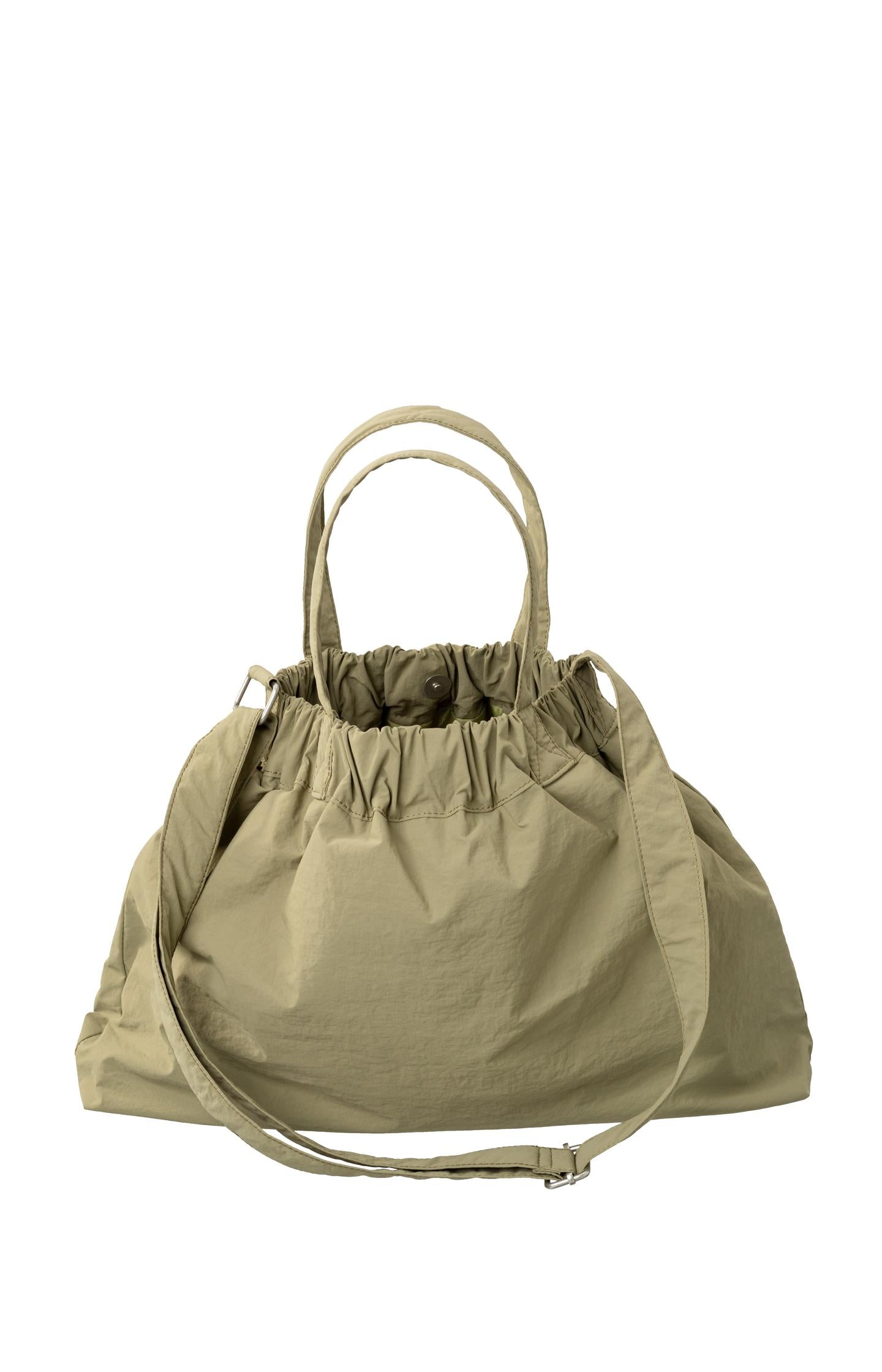 Crossbody sports bag with handle, side pockets and elastic