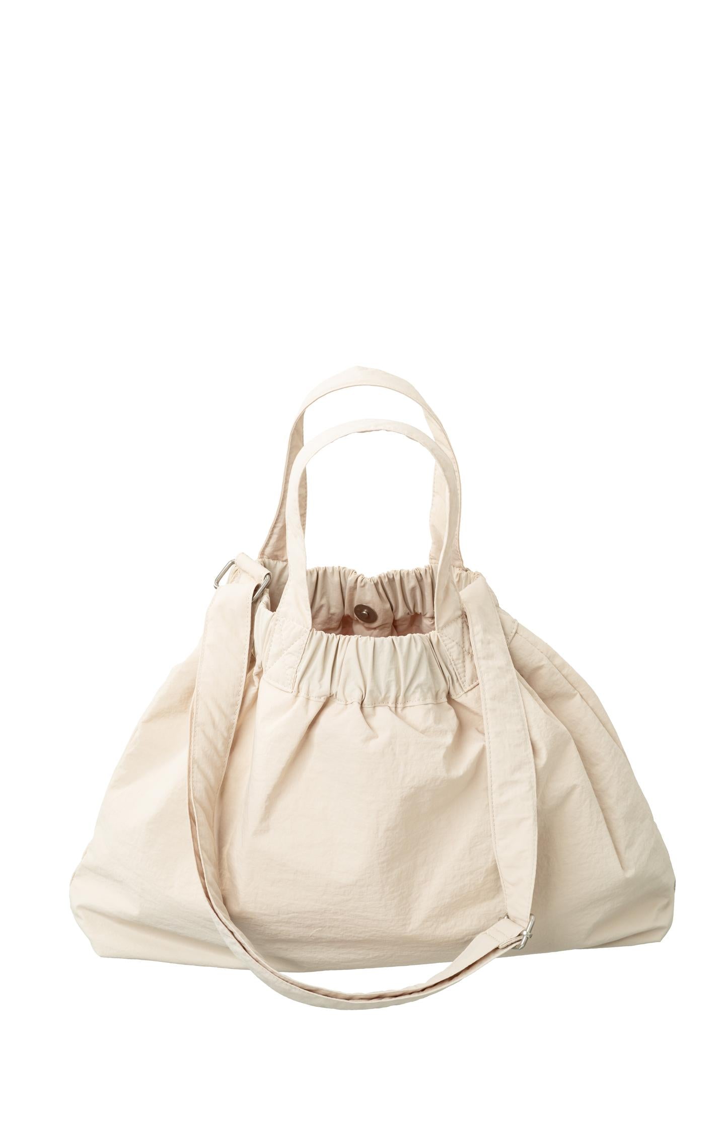 Crossbody sports bag with handle, side pockets and elastic