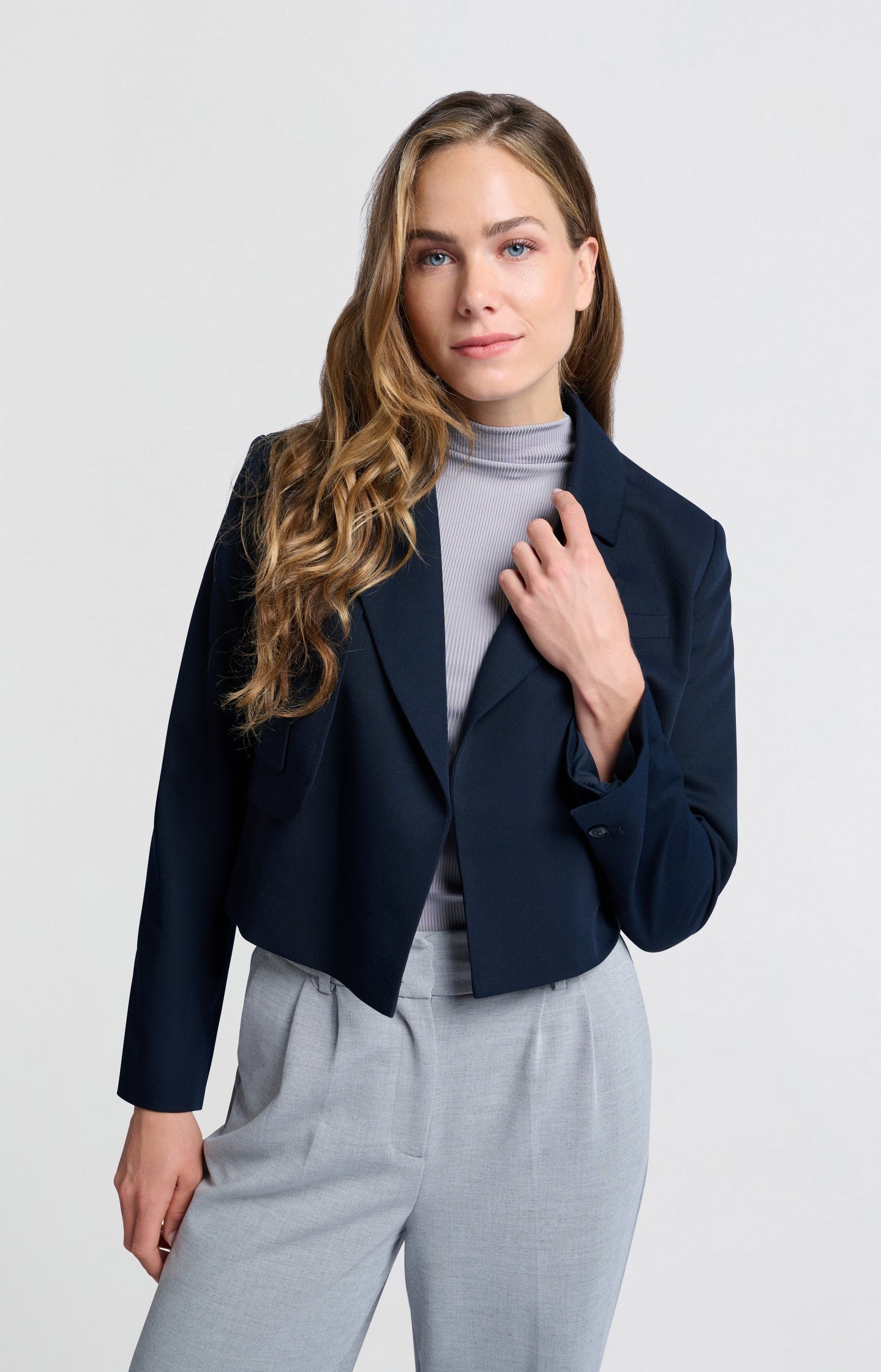 Dark blue woven cropped blazer with unique pocket detail