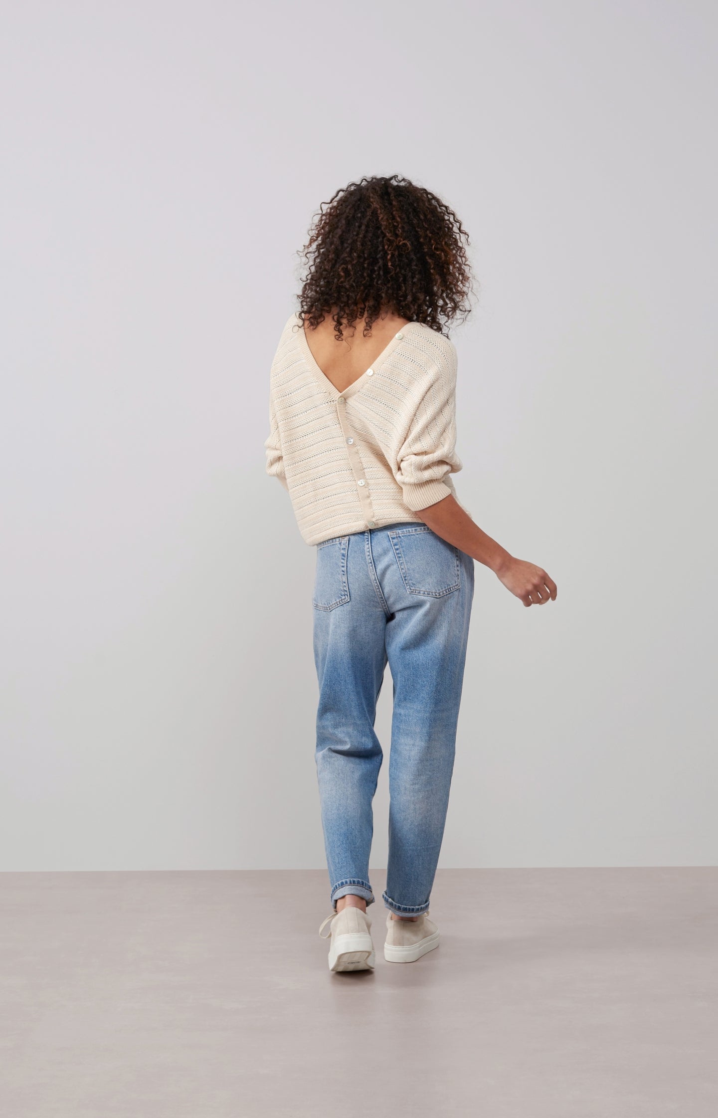 Double V-neck sweater with long sleeves and striped pattern