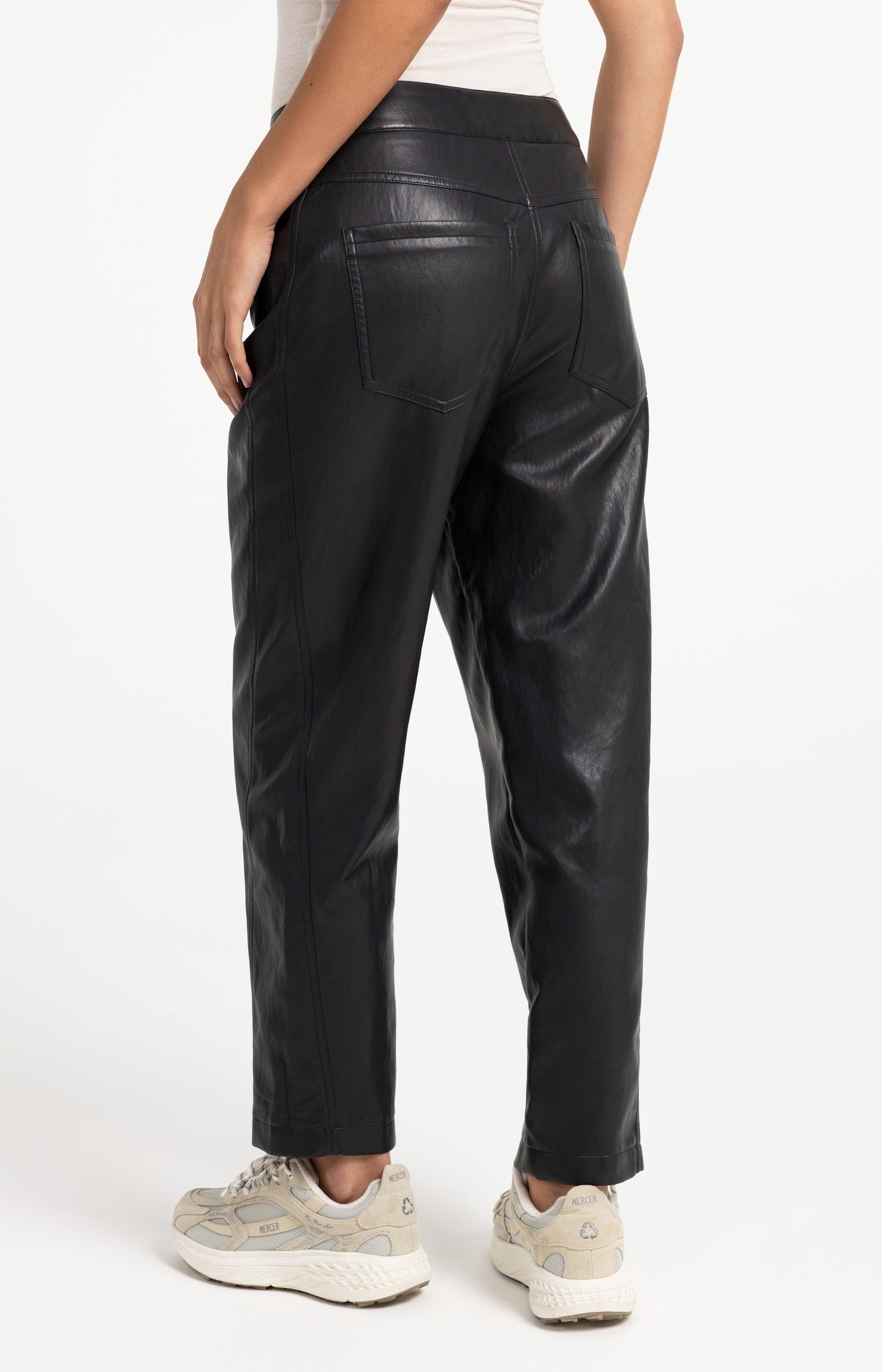 Faux leather carrot fit trousers with seam detail