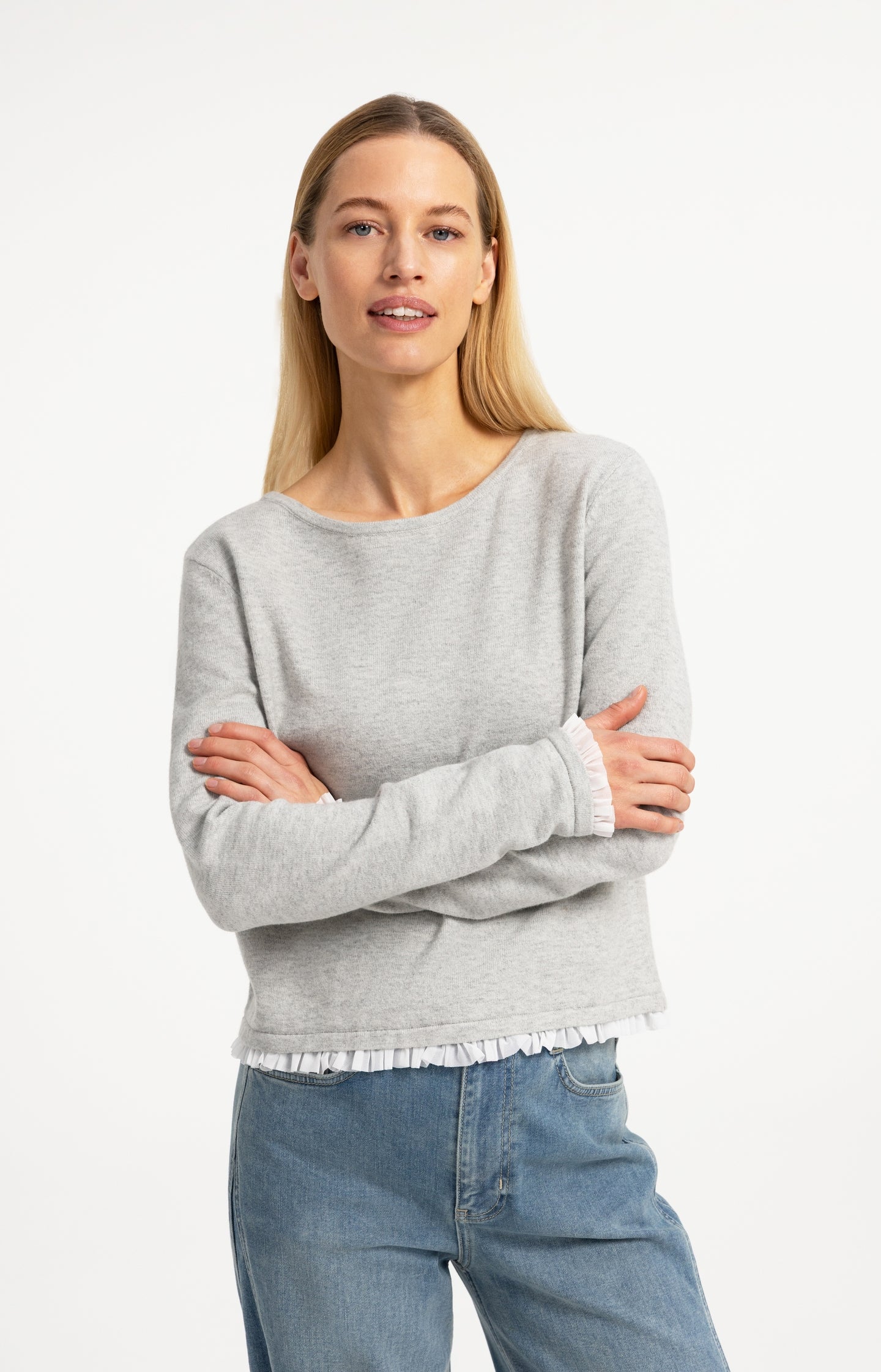 Fine knit top with woven ruffle trims
