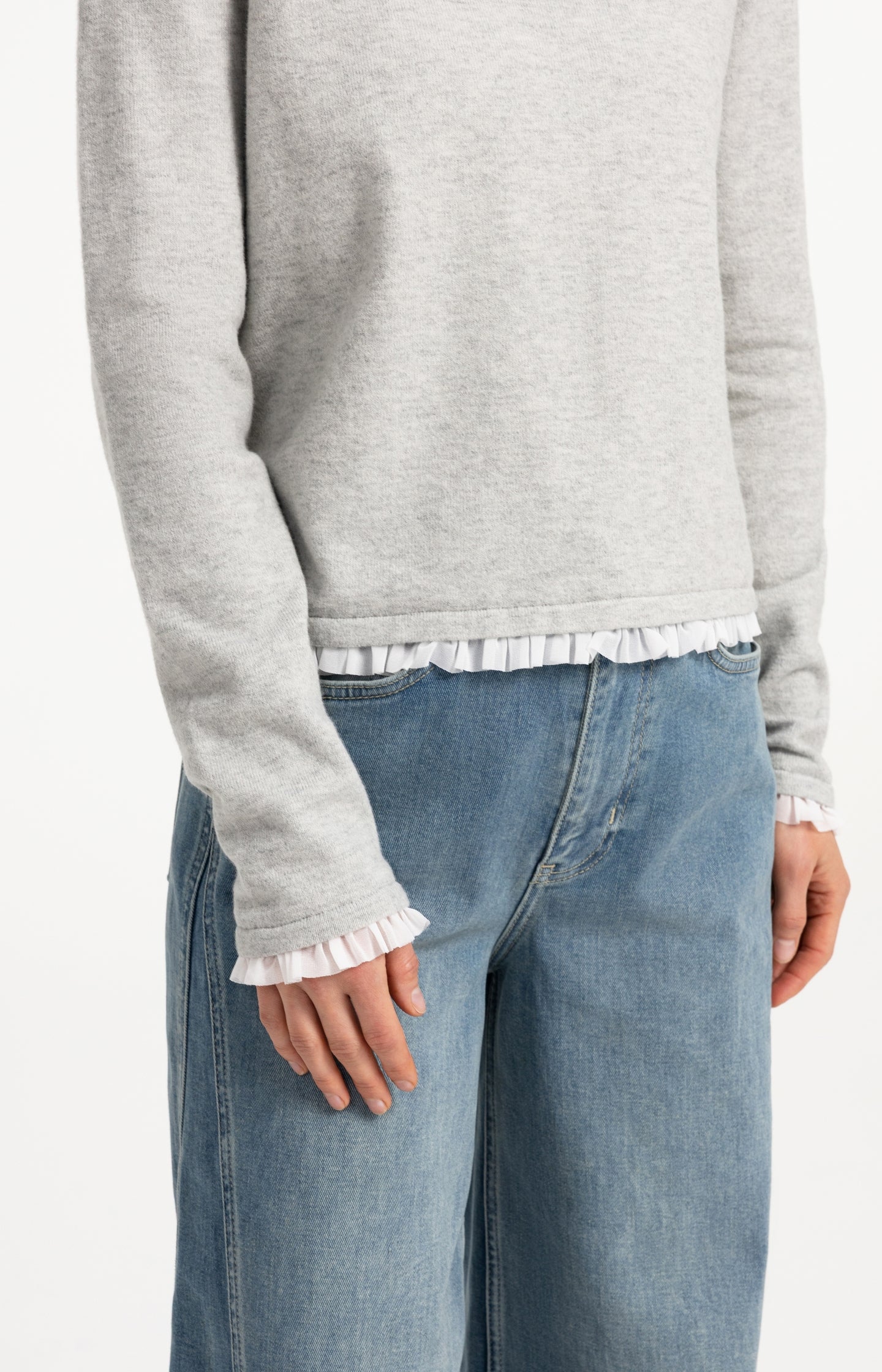 Fine knit top with woven ruffle trims