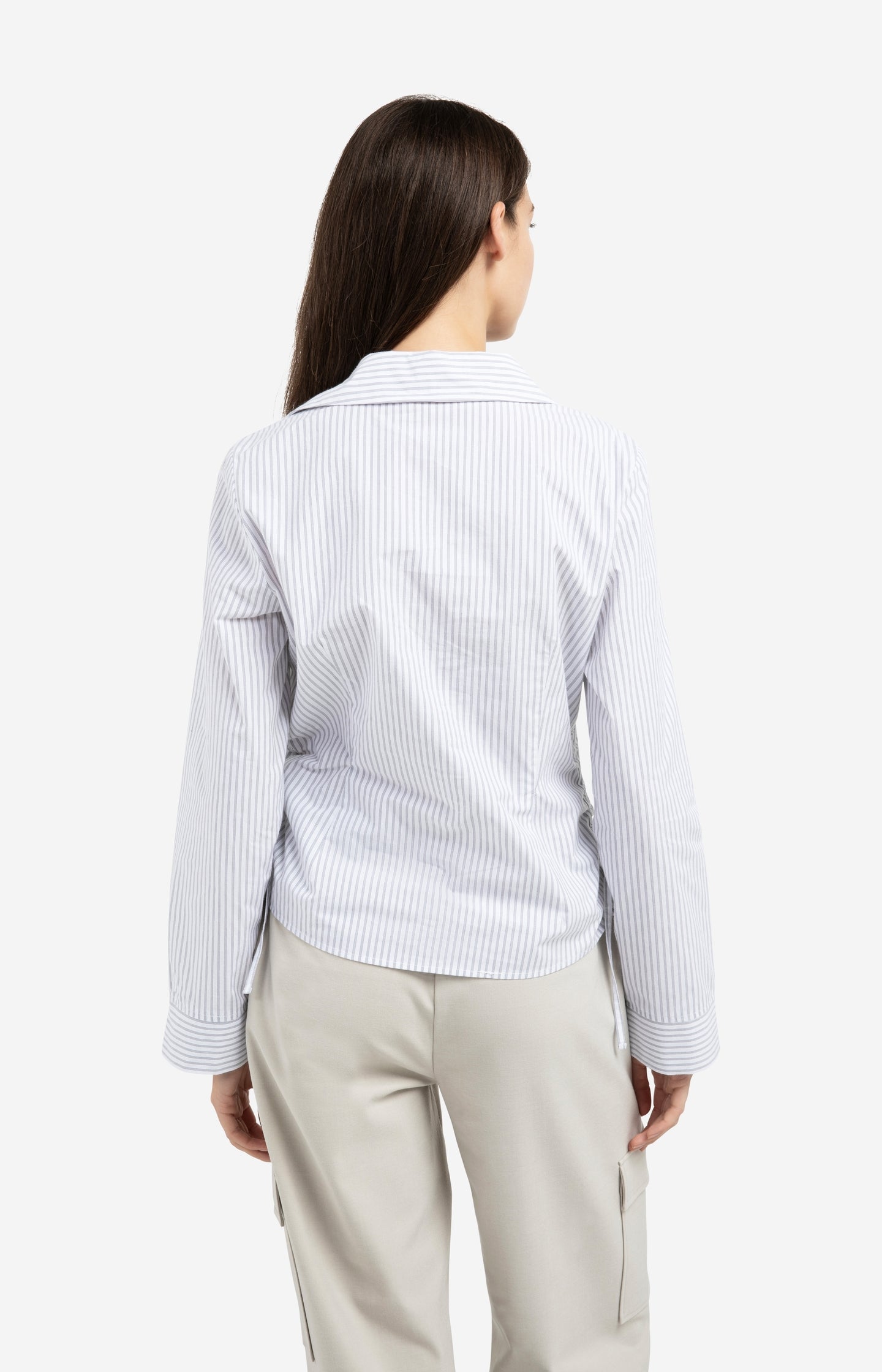 Fitted blouse with side drawstrings