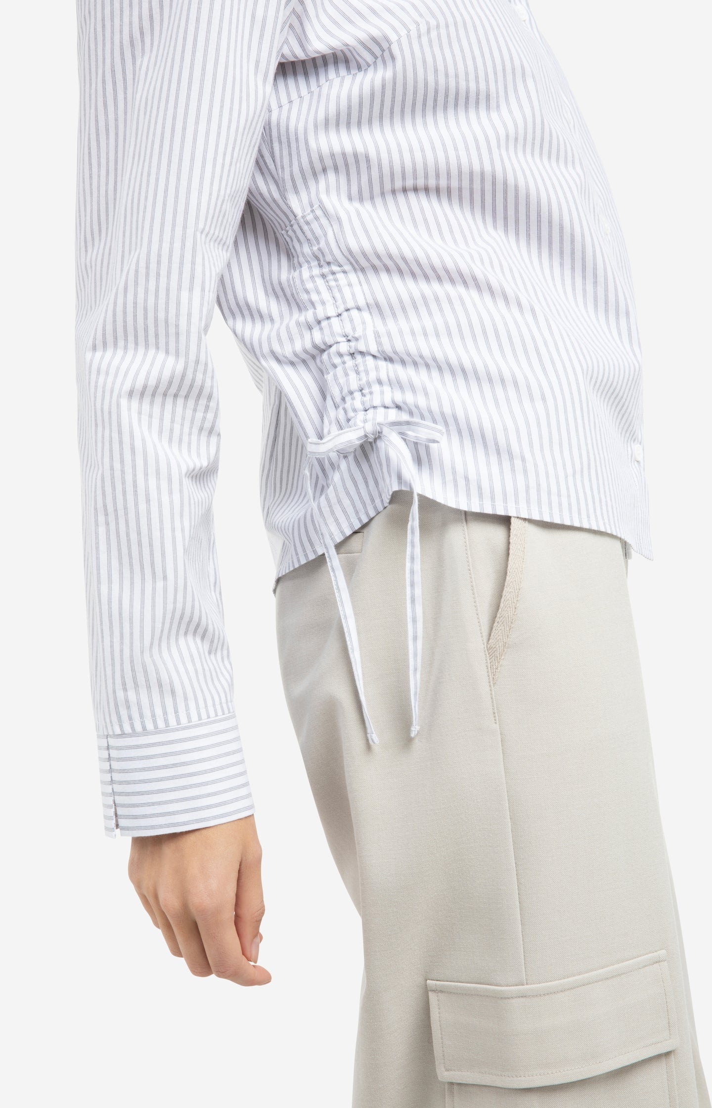 Fitted blouse with side drawstrings