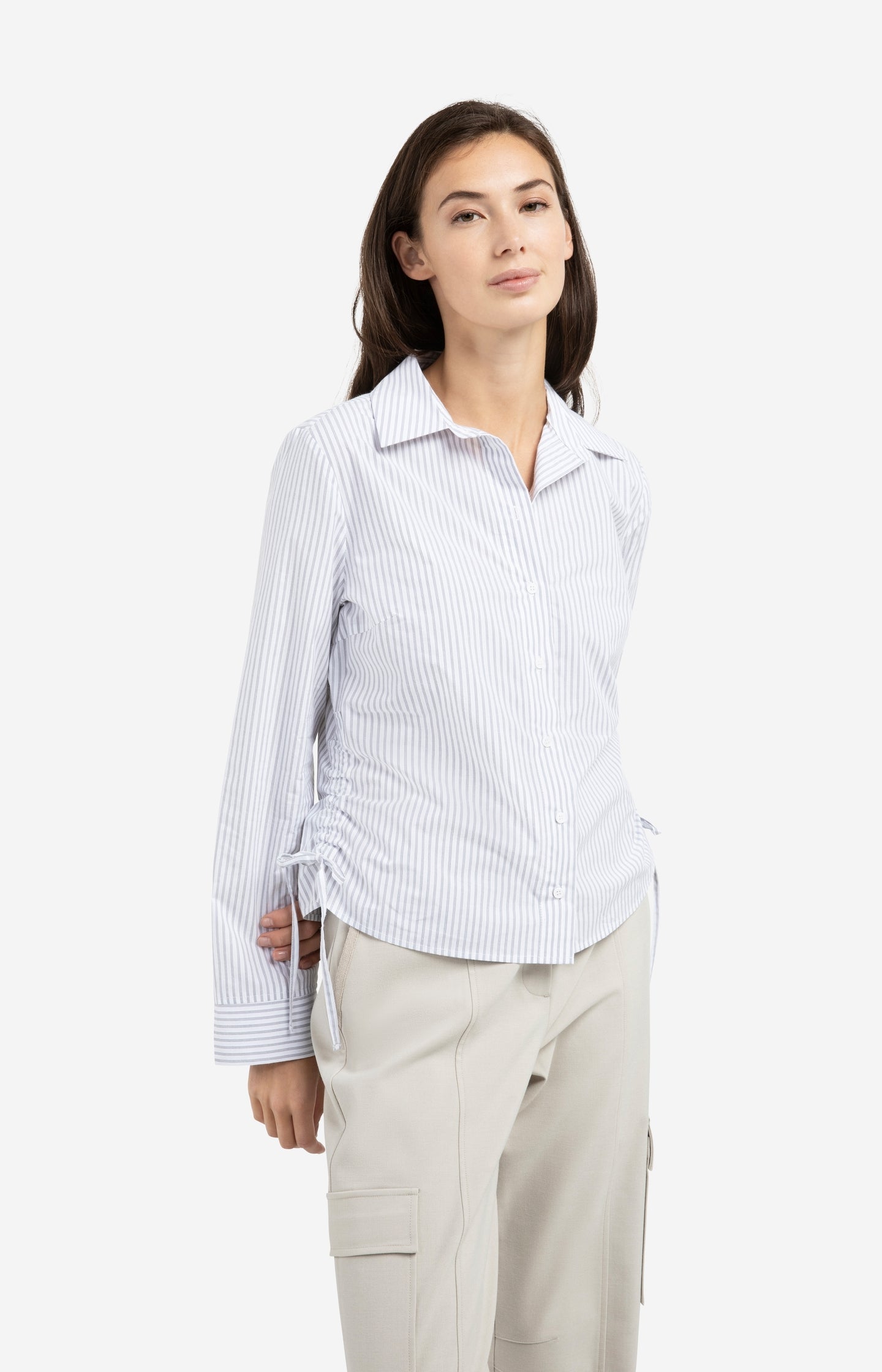Fitted blouse with side drawstrings