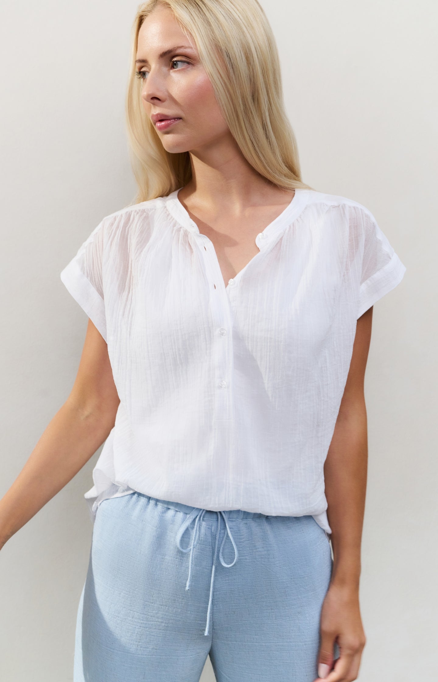 Flowy blouse with polo collar and cap sleeves