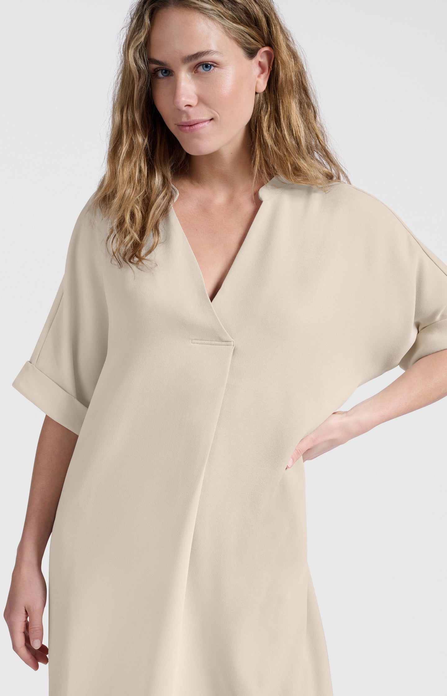 Flowy dress with V-neck and folded sleeves