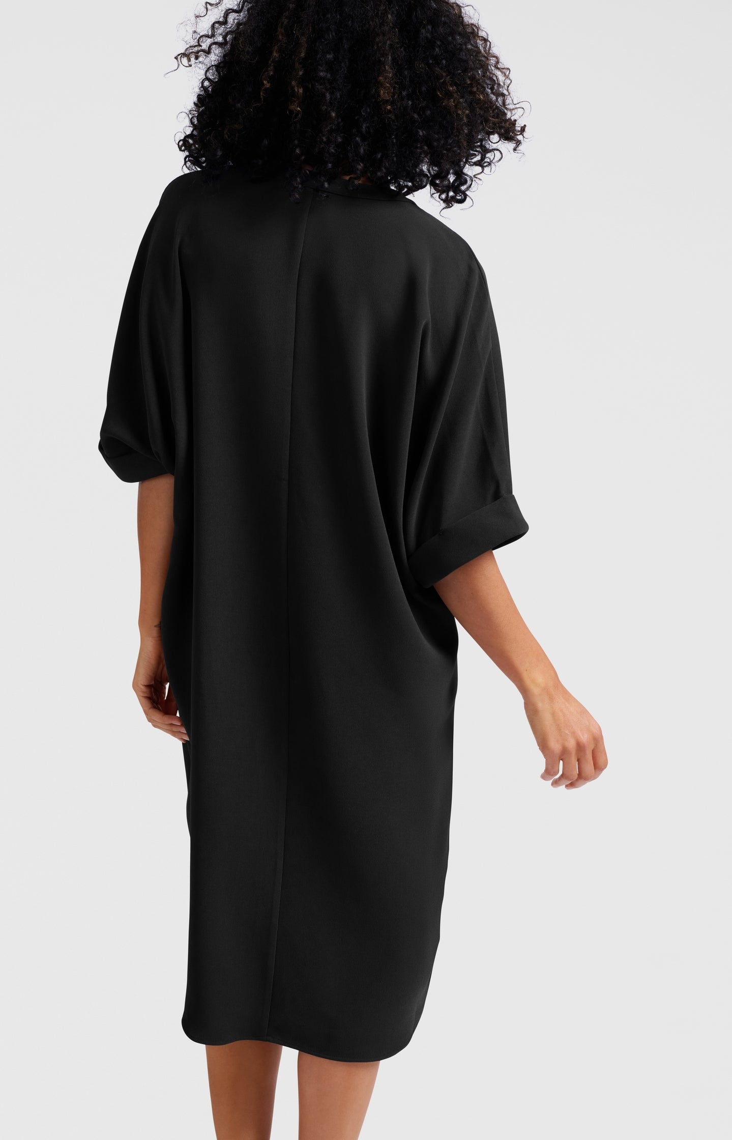 Flowy dress with V-neck and folded sleeves