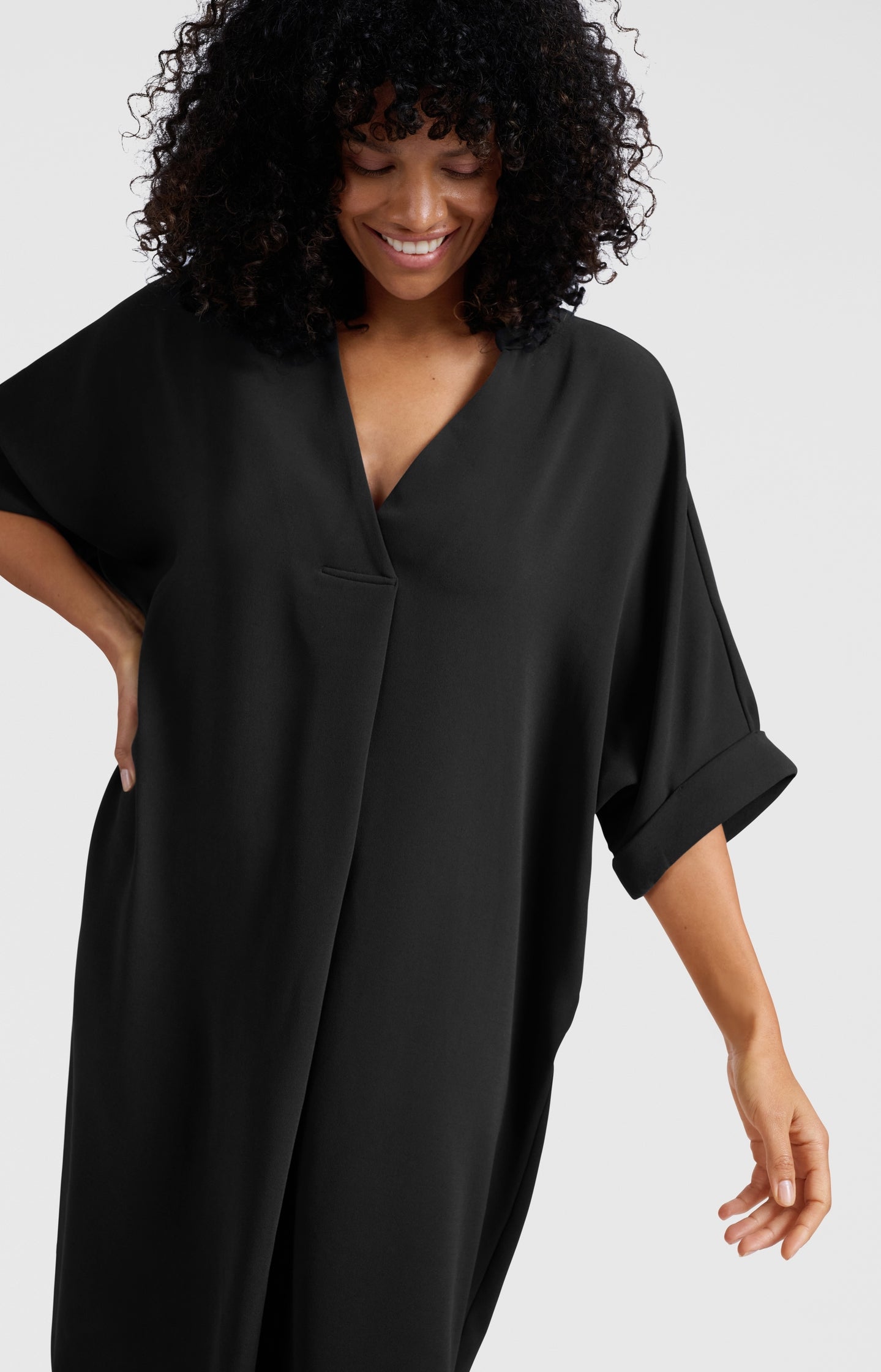 Flowy dress with V-neck and folded sleeves