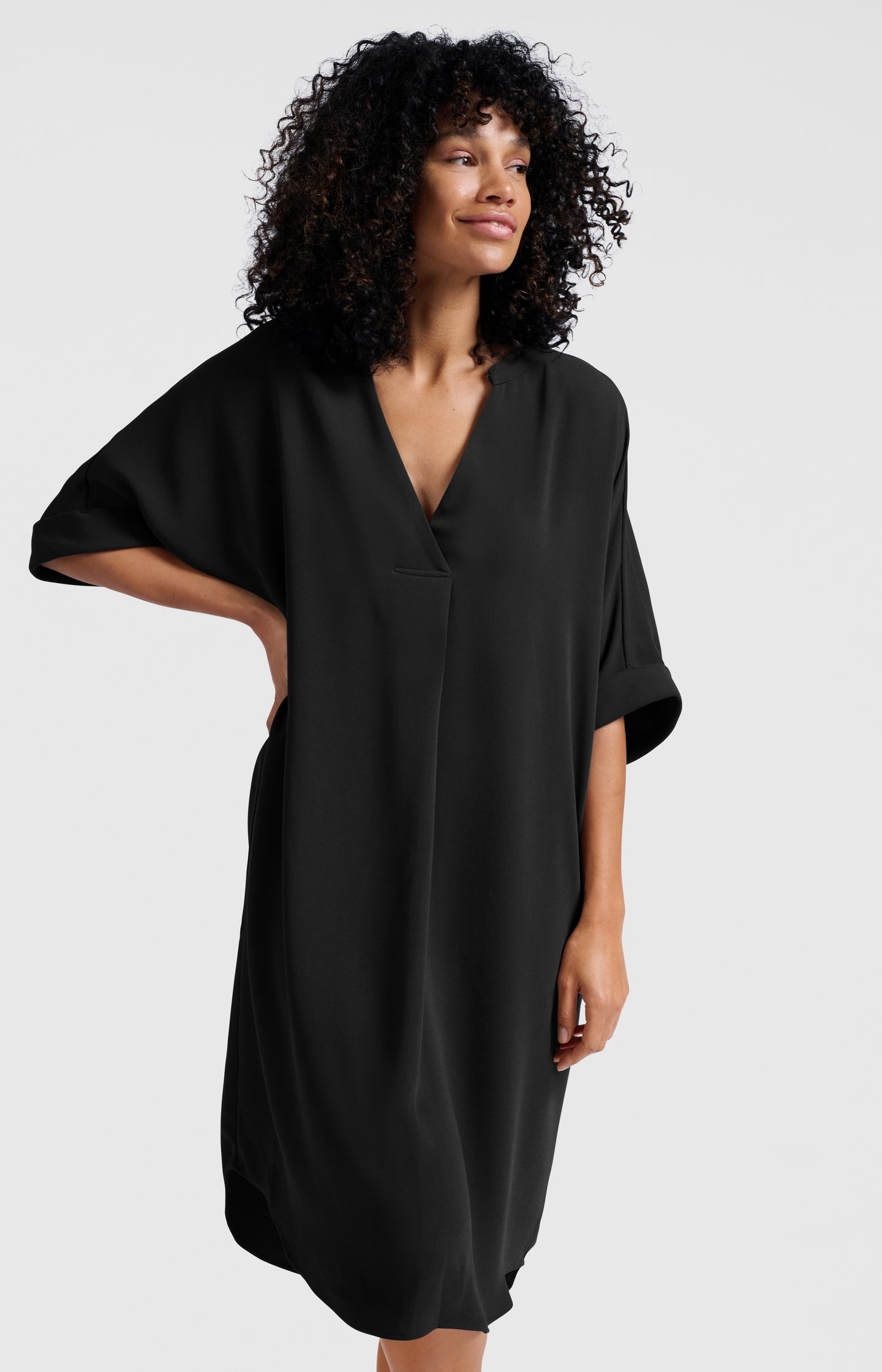 Flowy dress with V-neck and folded sleeves