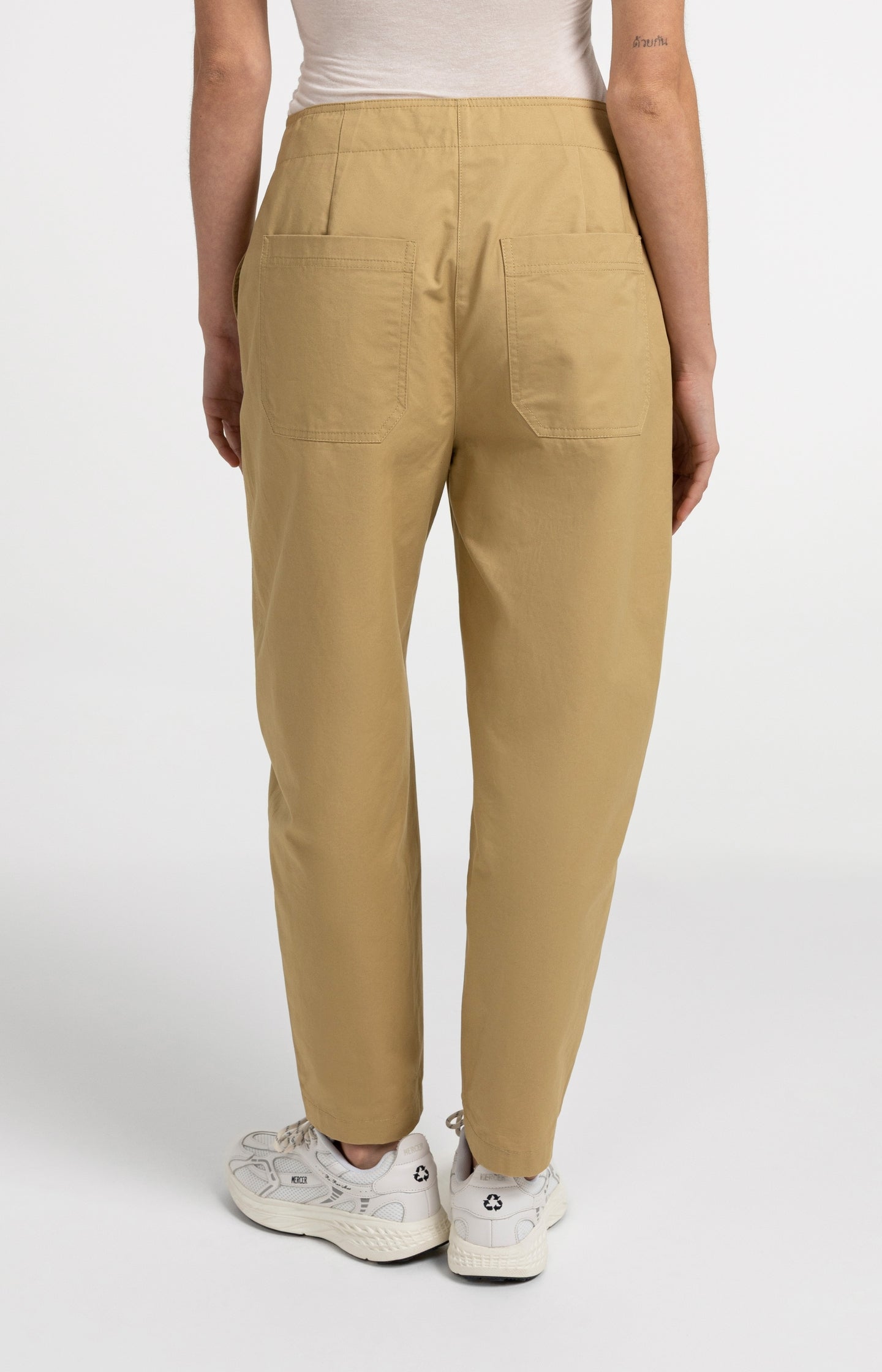 High-waist barrel-leg trousers with button detail