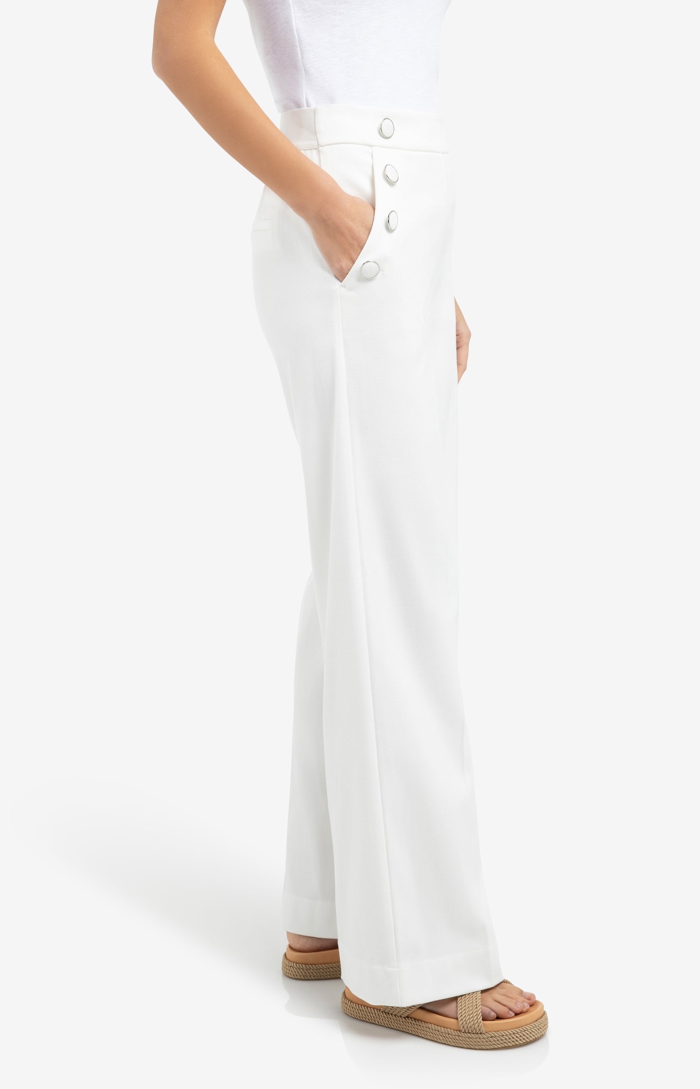 High waist trousers with decorative buttons and wide legs