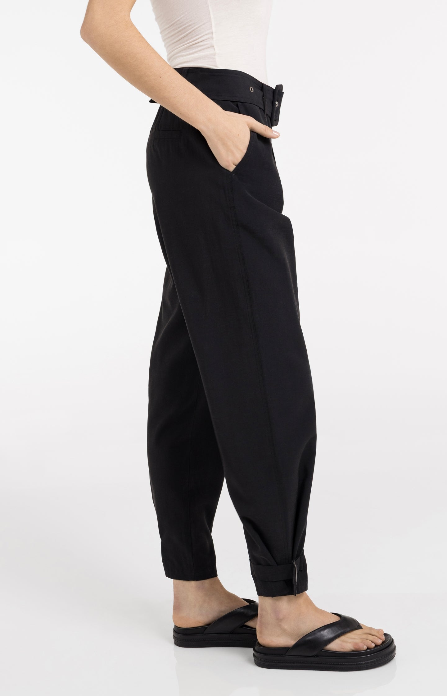 High waist trousers with strap details at the bottom hem