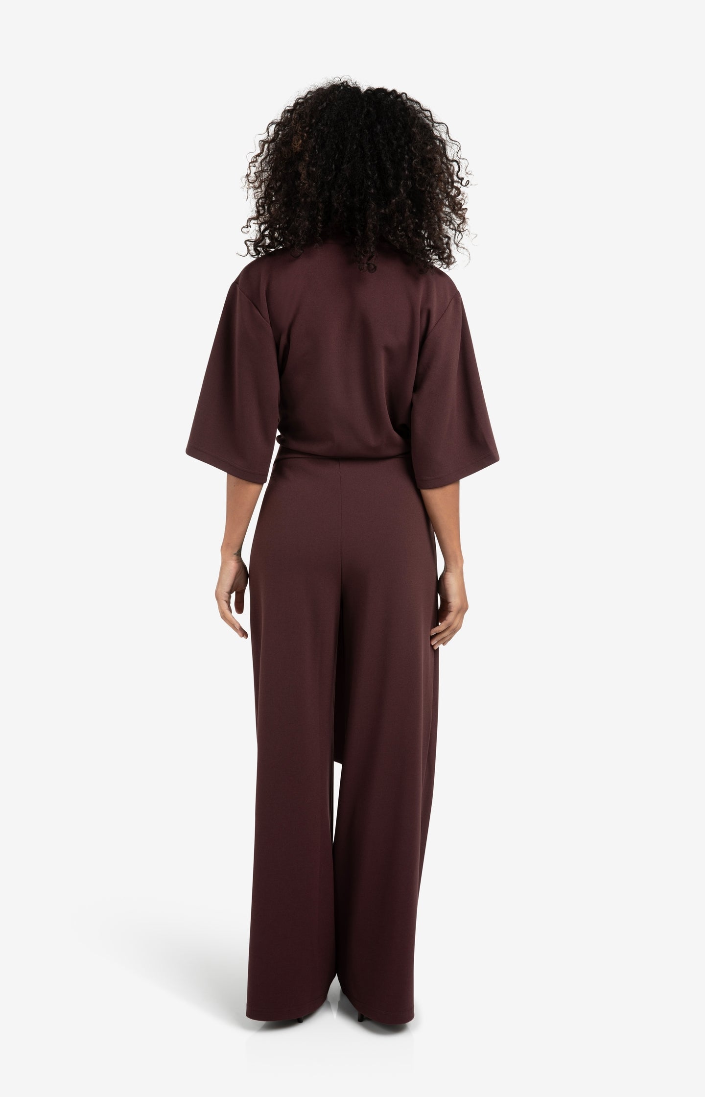 Paarse jersey jumpsuit met korte mouwen en strikceintuur