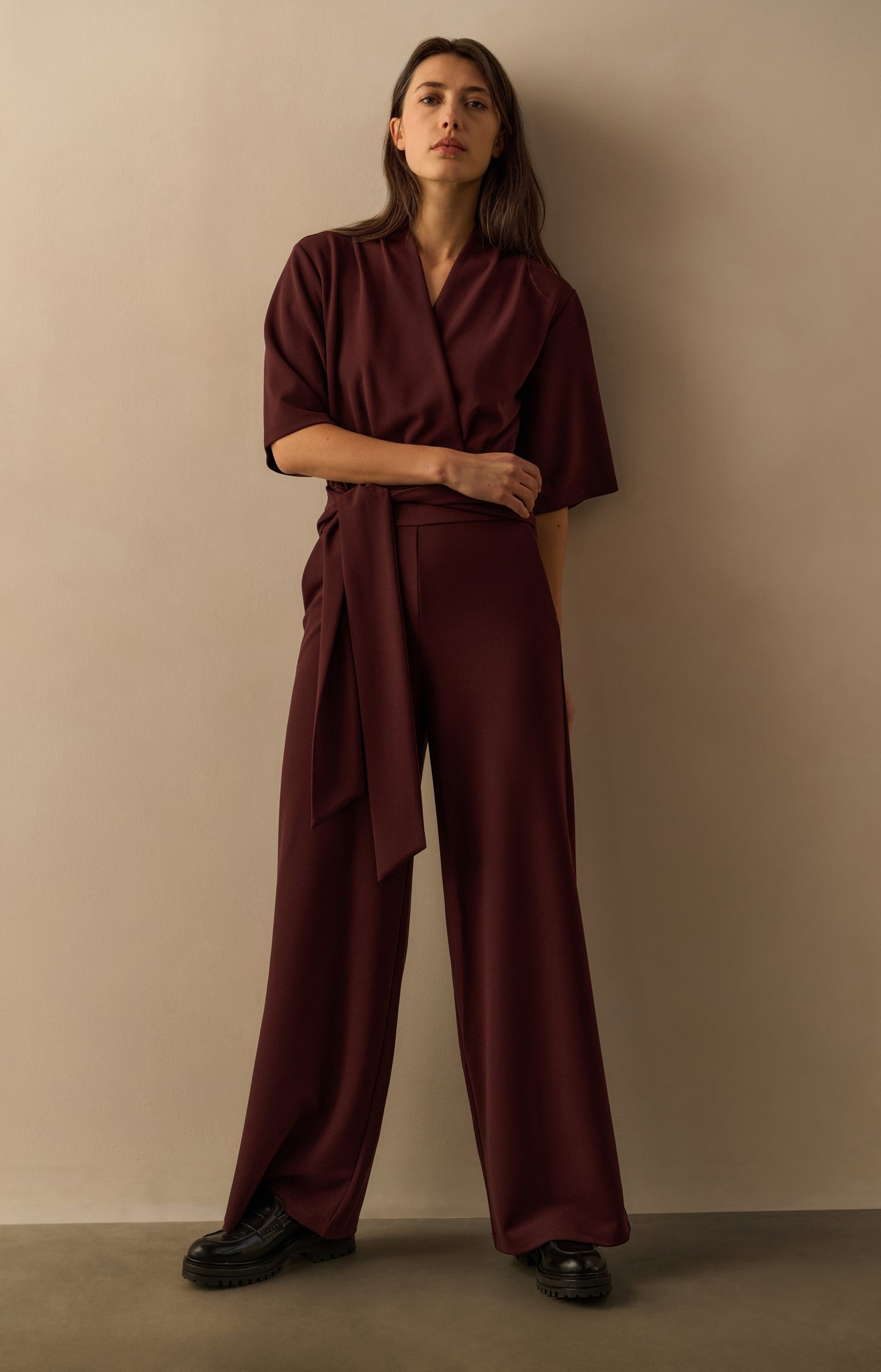 Jersey jumpsuit with short sleeves and tie belt
