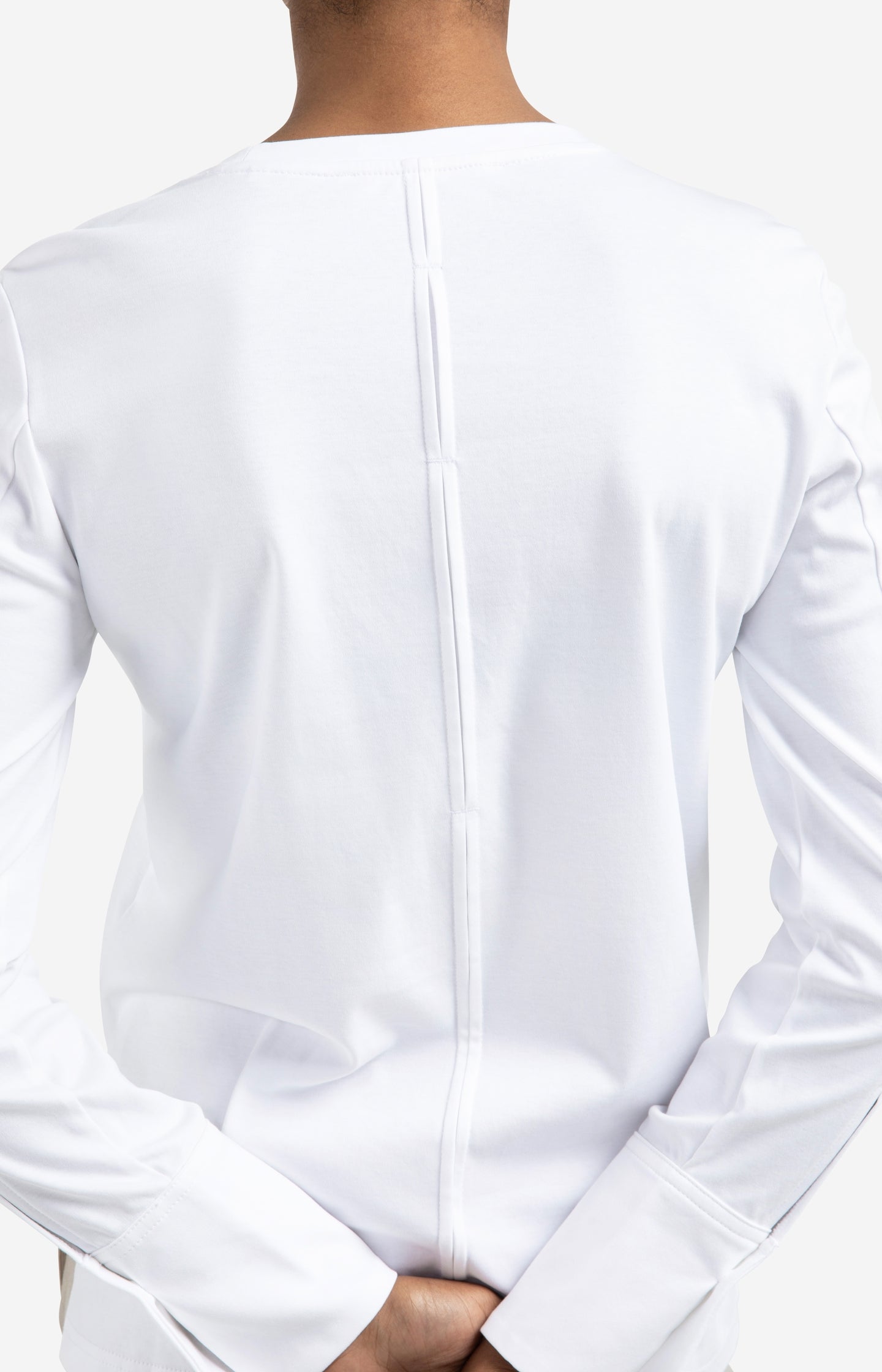 Jersey top with woven cuffs and slit detail