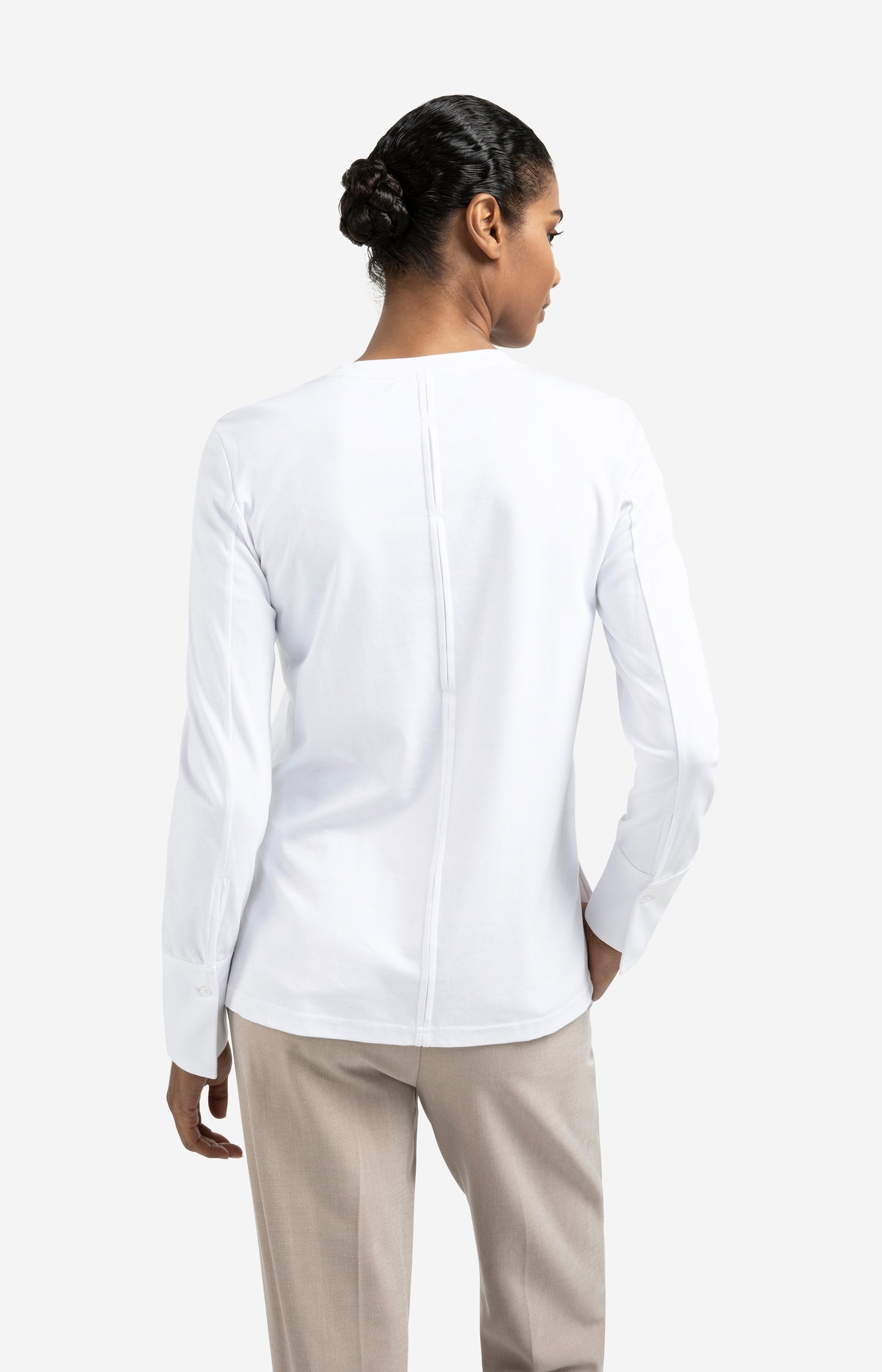 Jersey top with woven cuffs and slit detail