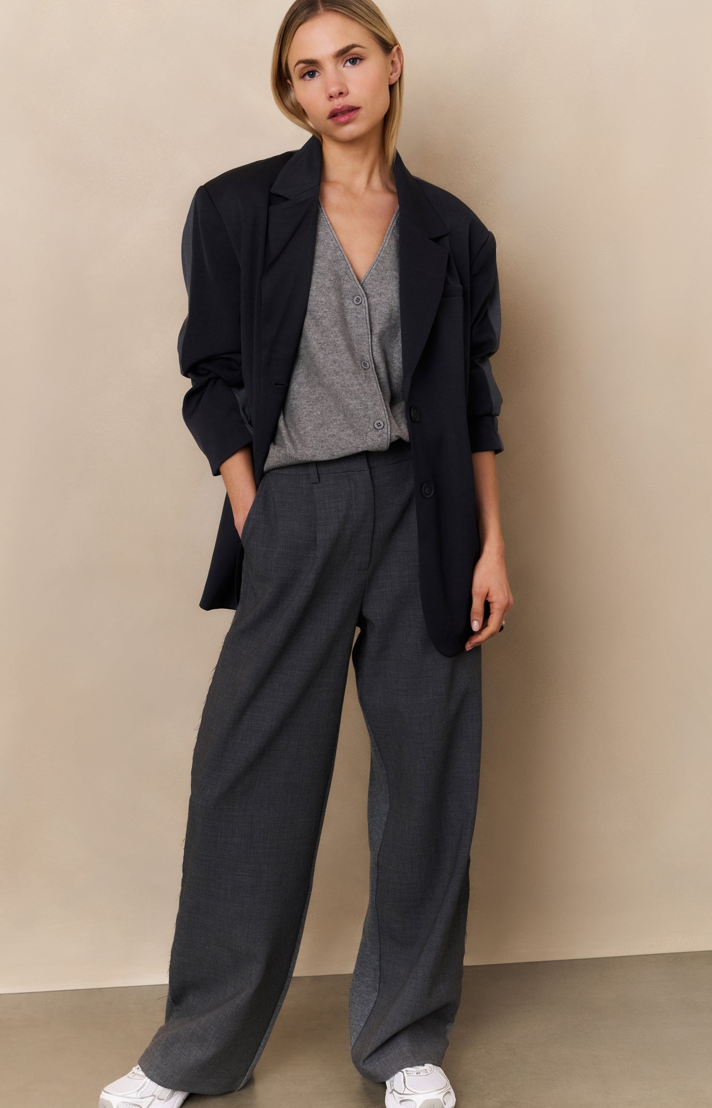 Knitted gilet with V-neck and asymmetric buttoning