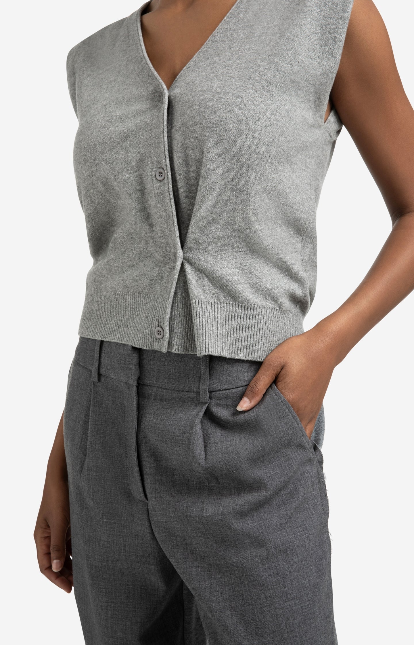 Knitted gilet with V-neck and asymmetric buttoning