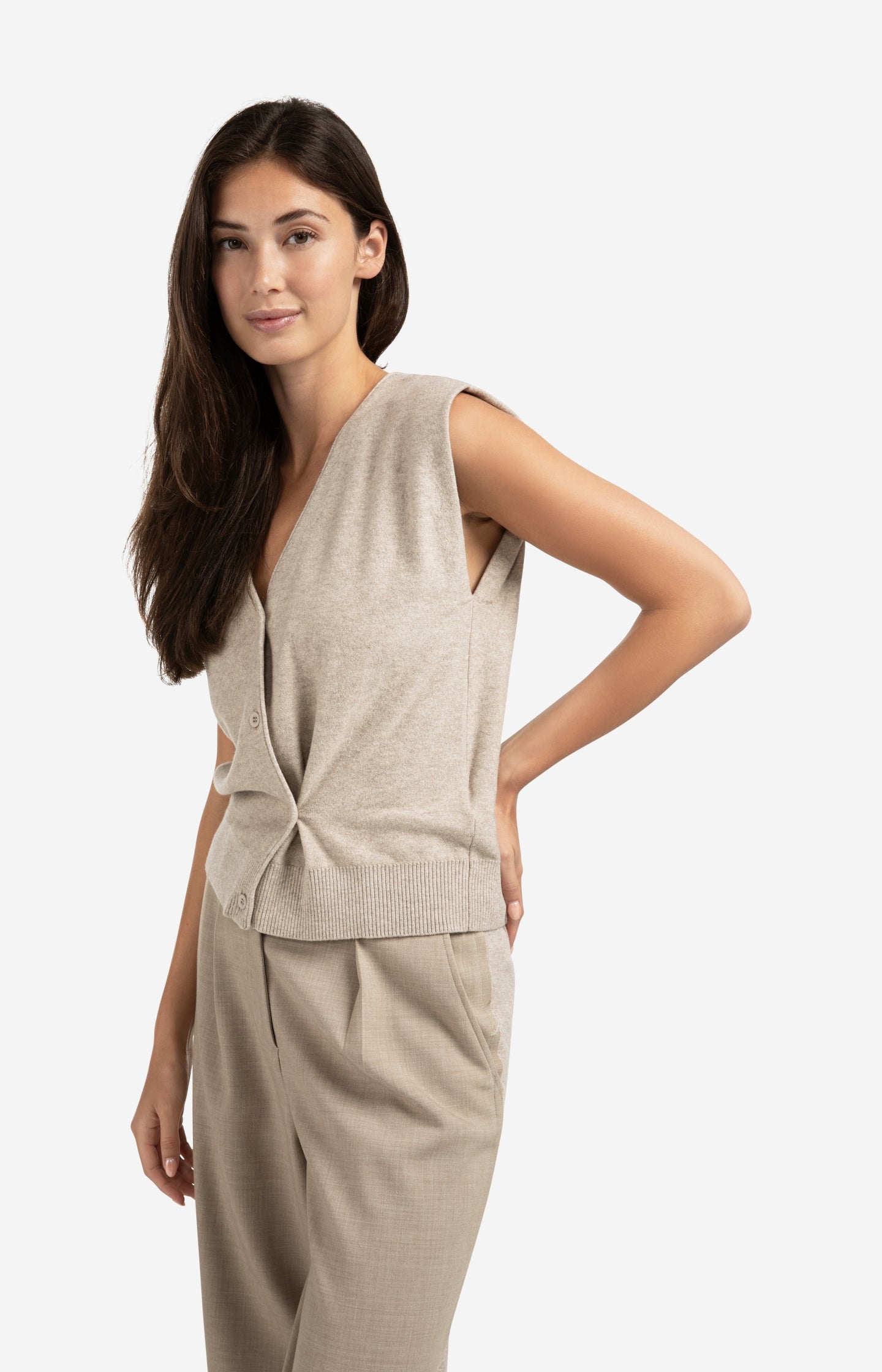 Knitted gilet with V-neck and asymmetric buttoning