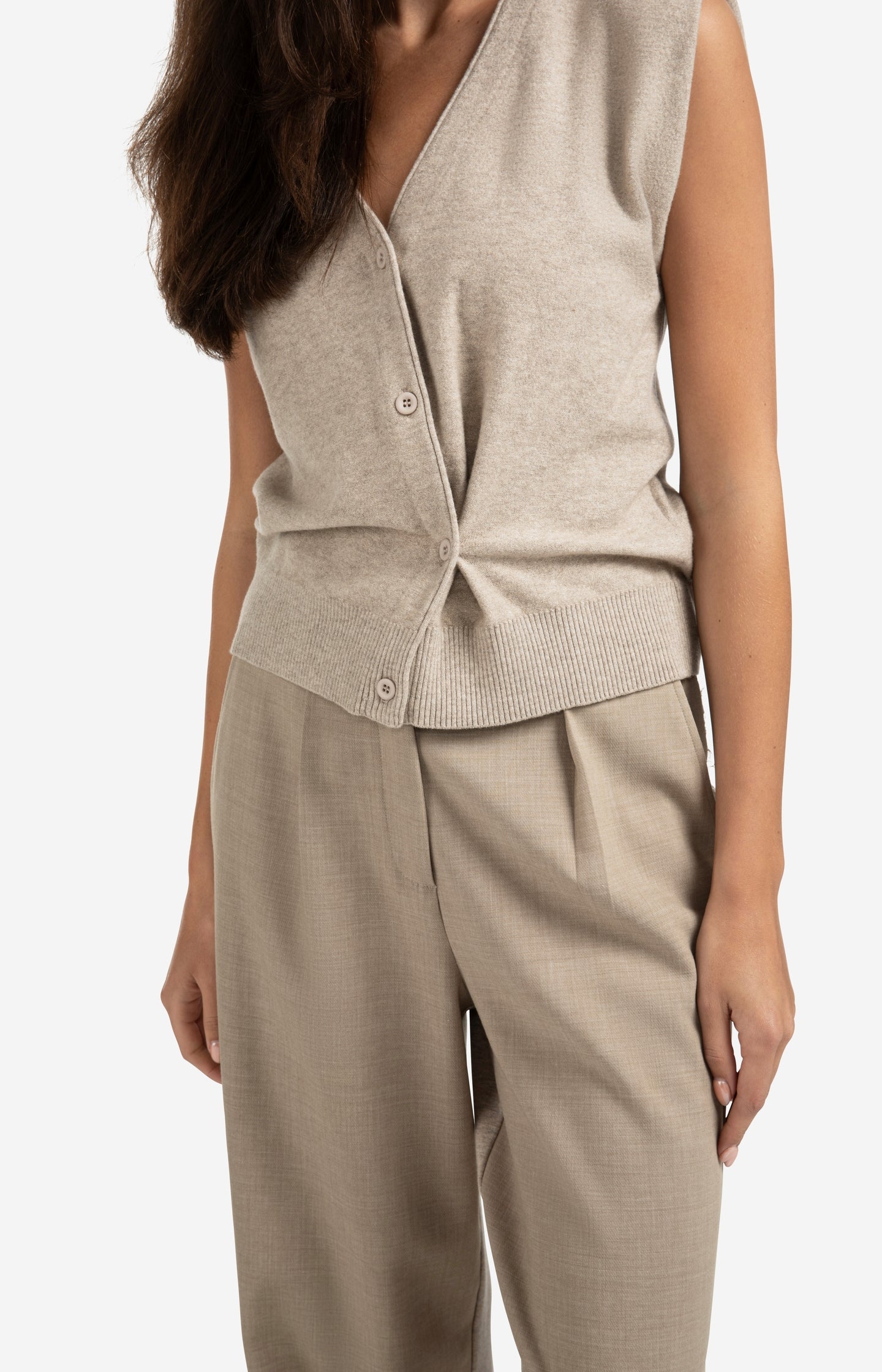 Knitted gilet with V-neck and asymmetric buttoning