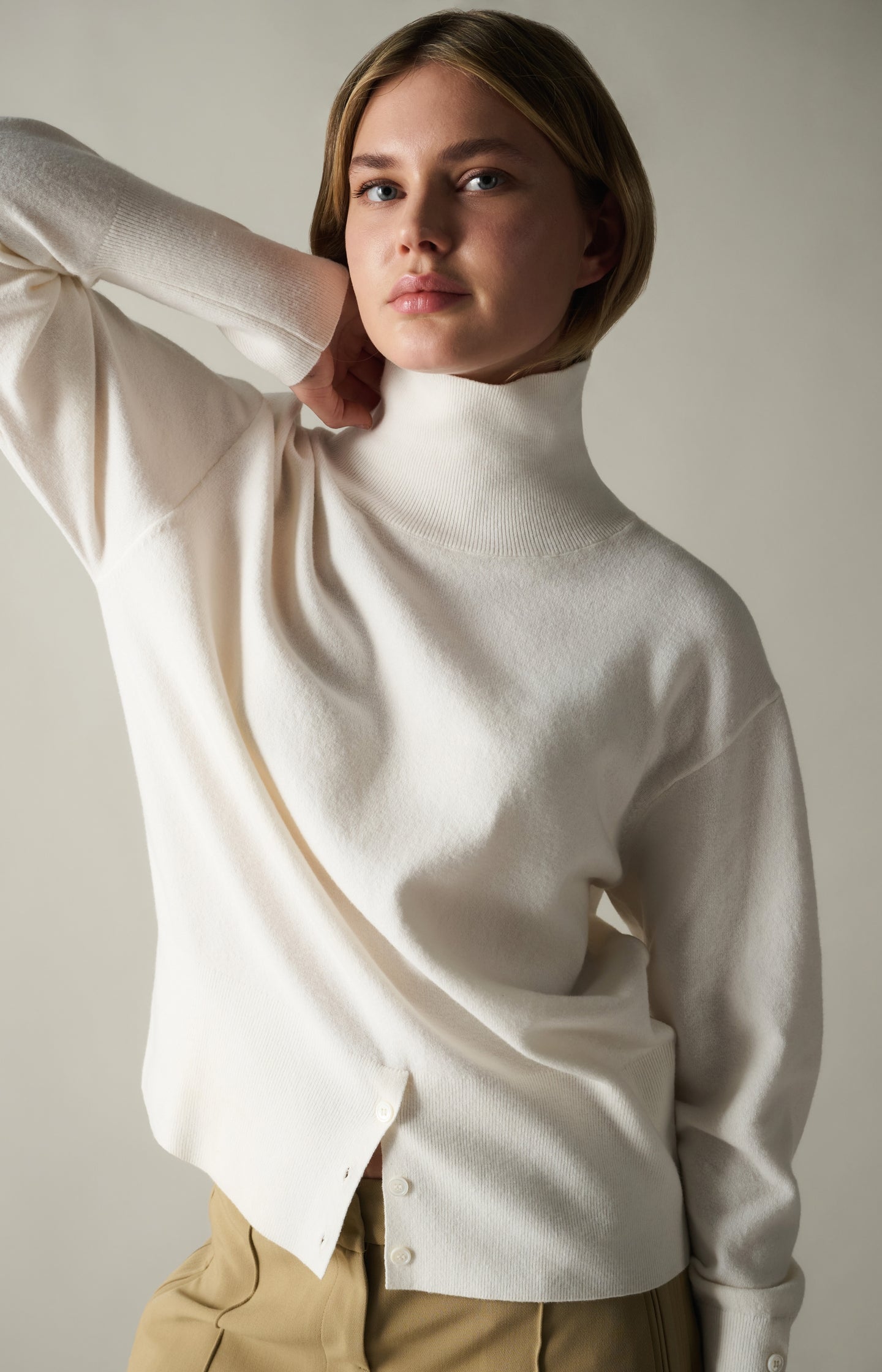 Knitted high neck sweater with button details