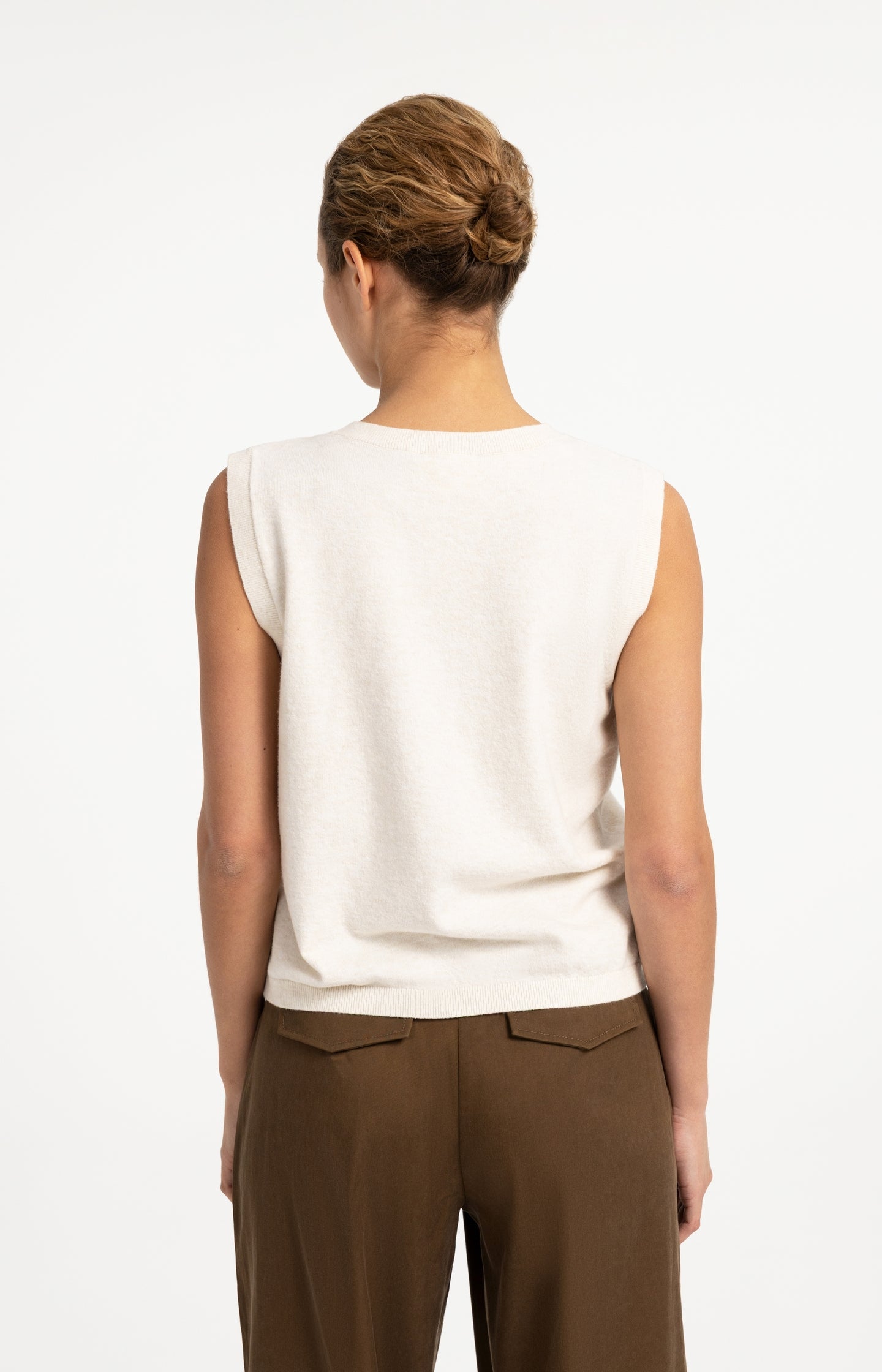 Knitted spencer with button closure