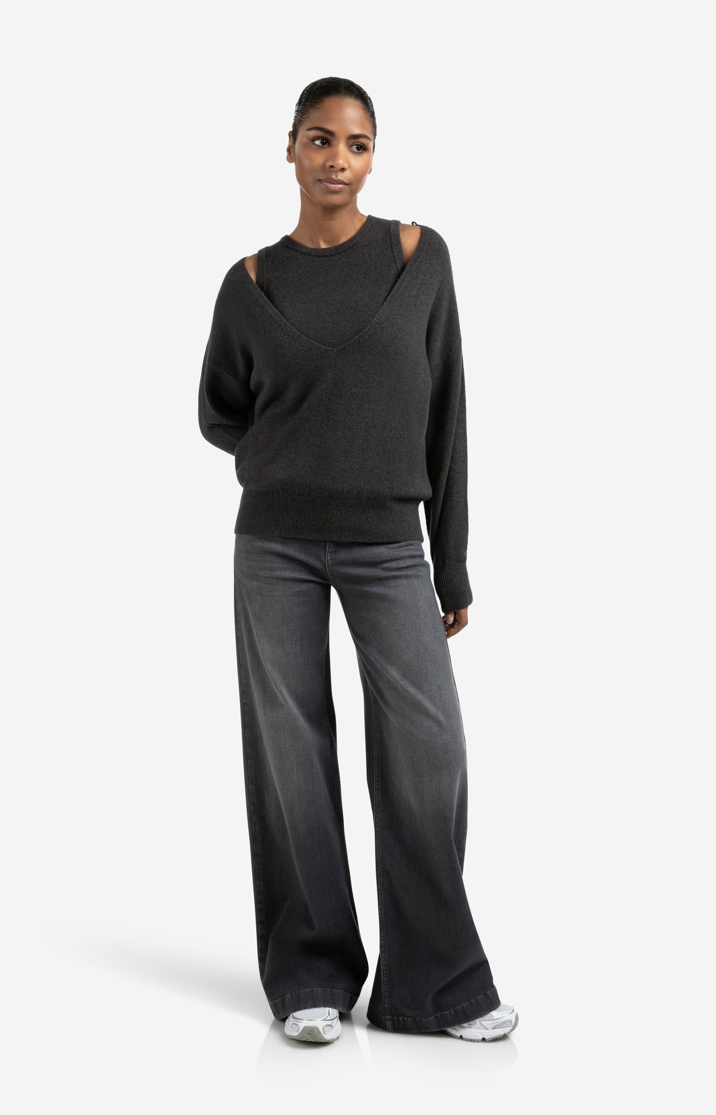 Knitted sweater with deep V-neck and layered top