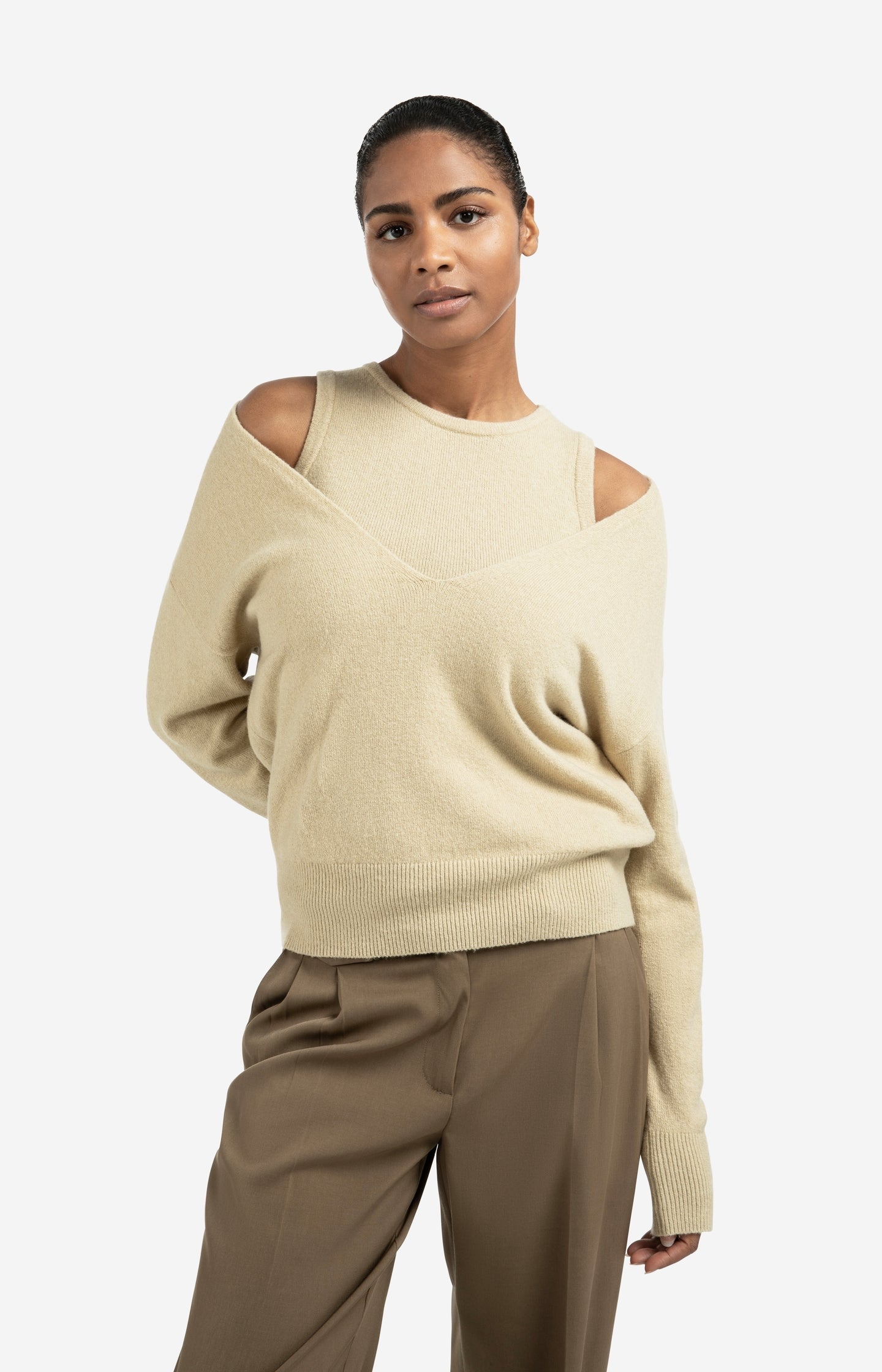 Knitted sweater with deep V-neck and layered top