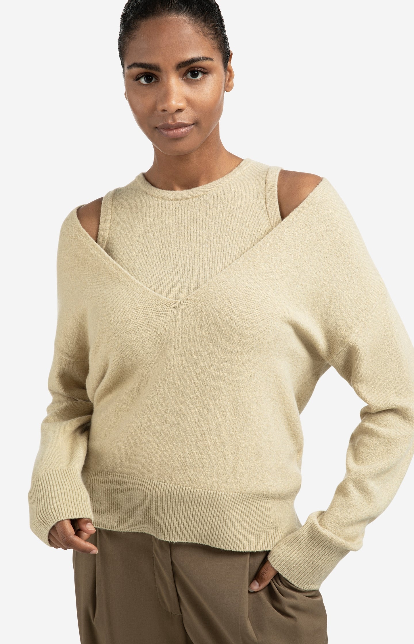 Knitted sweater with deep V-neck and layered top