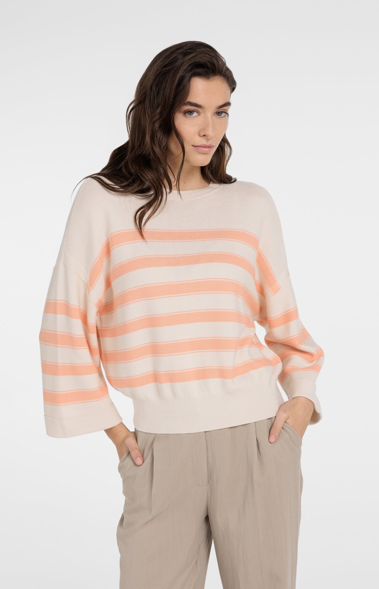 Knitted sweater with stripes and wide sleeves