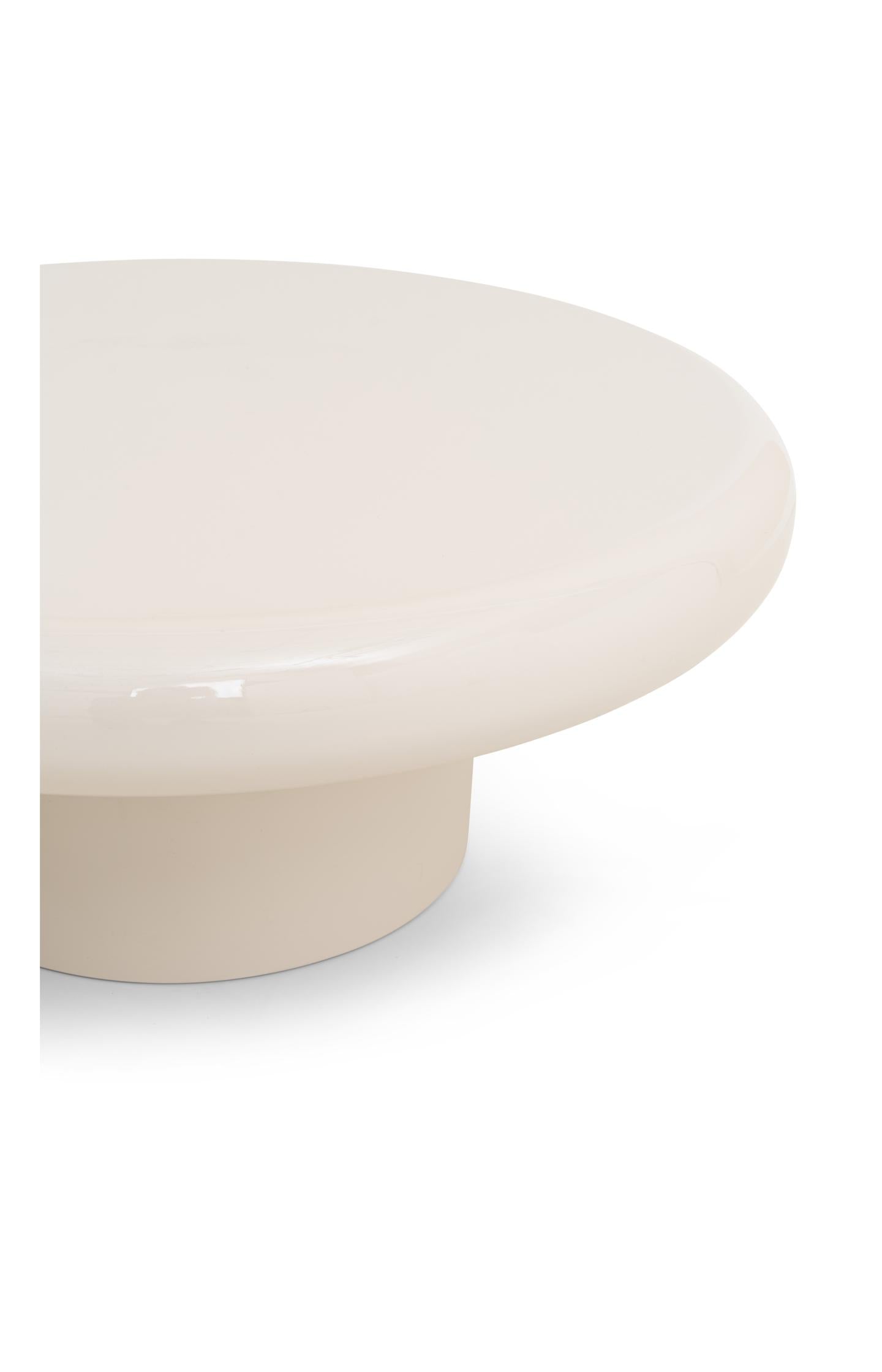 Large round coffee table with glossy finish