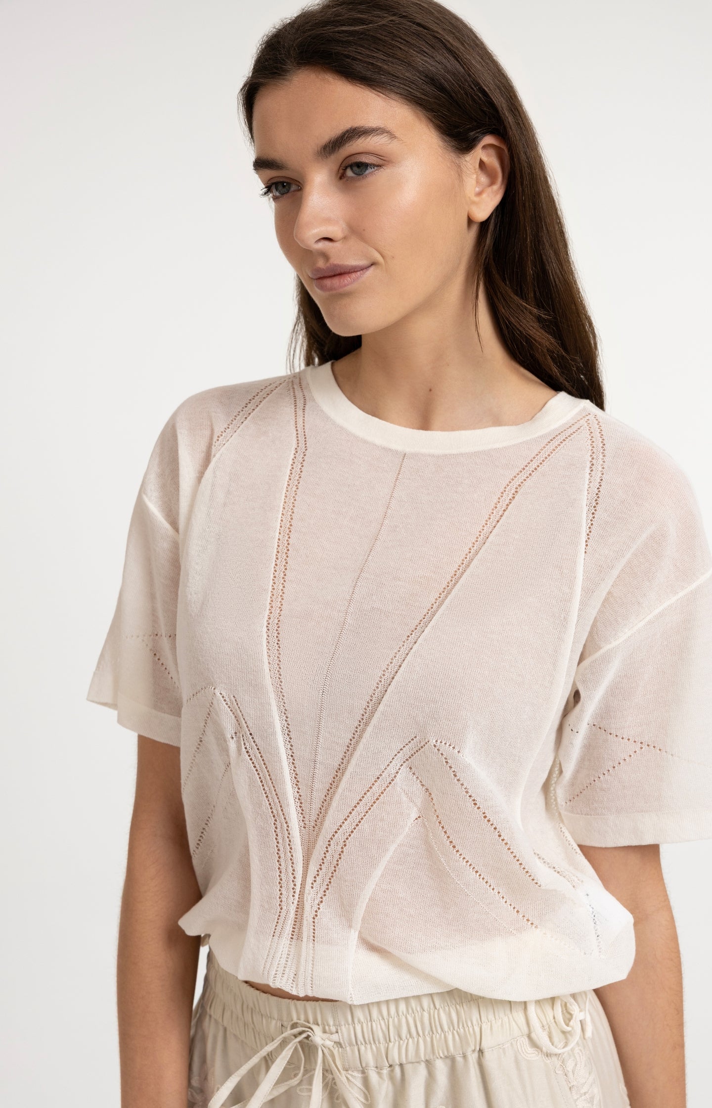 Open-knit top with ajour pattern and tie details