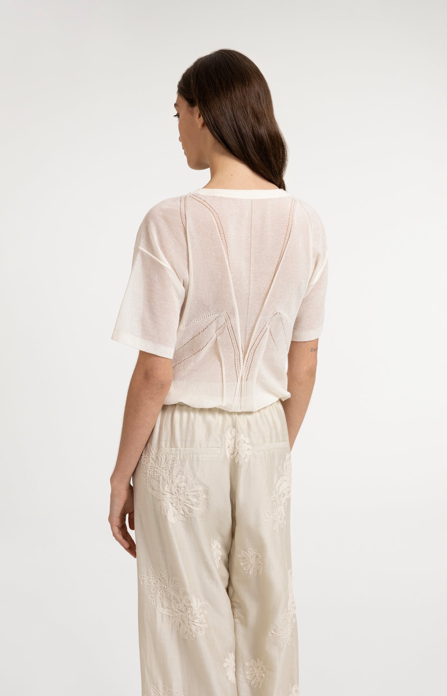 Open-knit top with ajour pattern and tie details