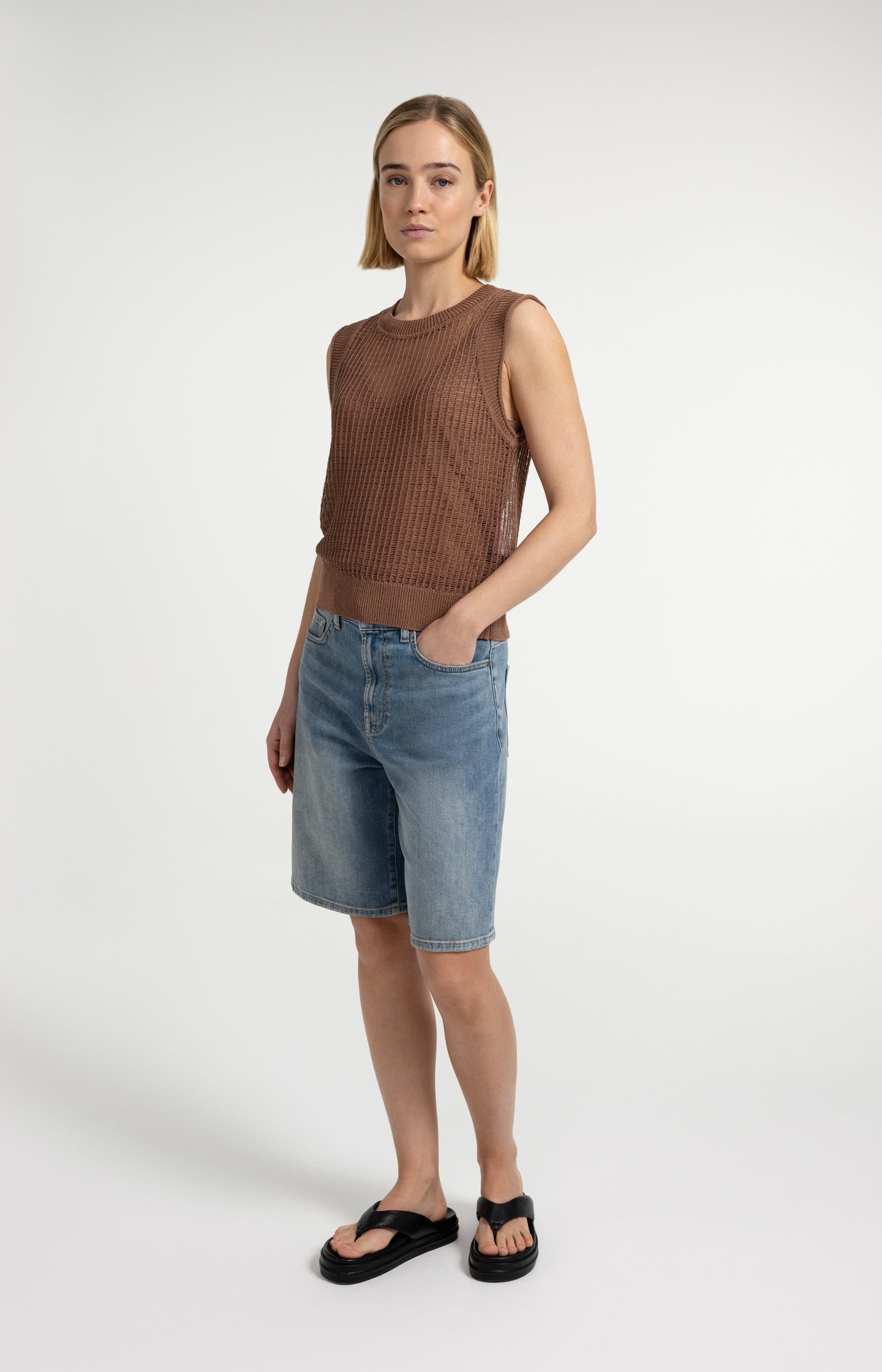 Open-knit top with matching underlayer