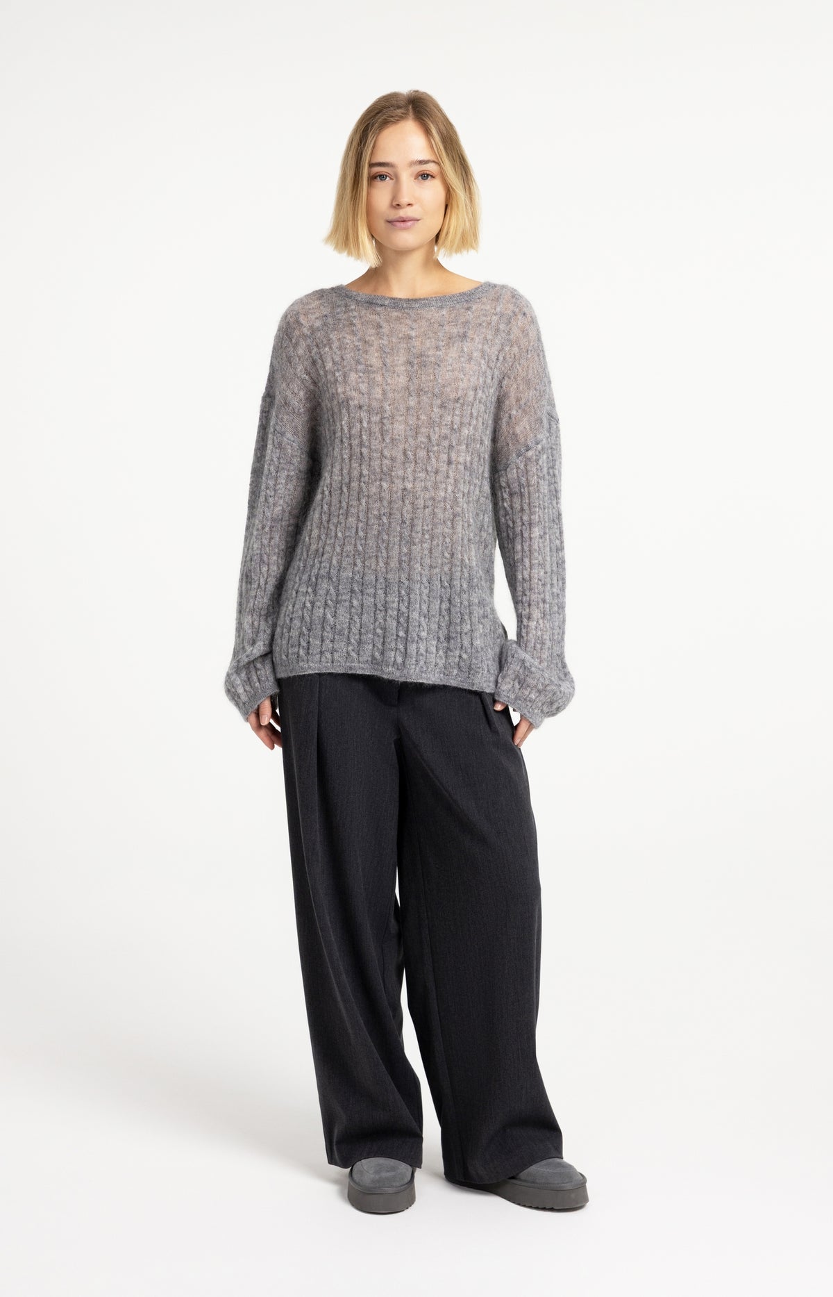 Oversized cable sweater with boat neckline