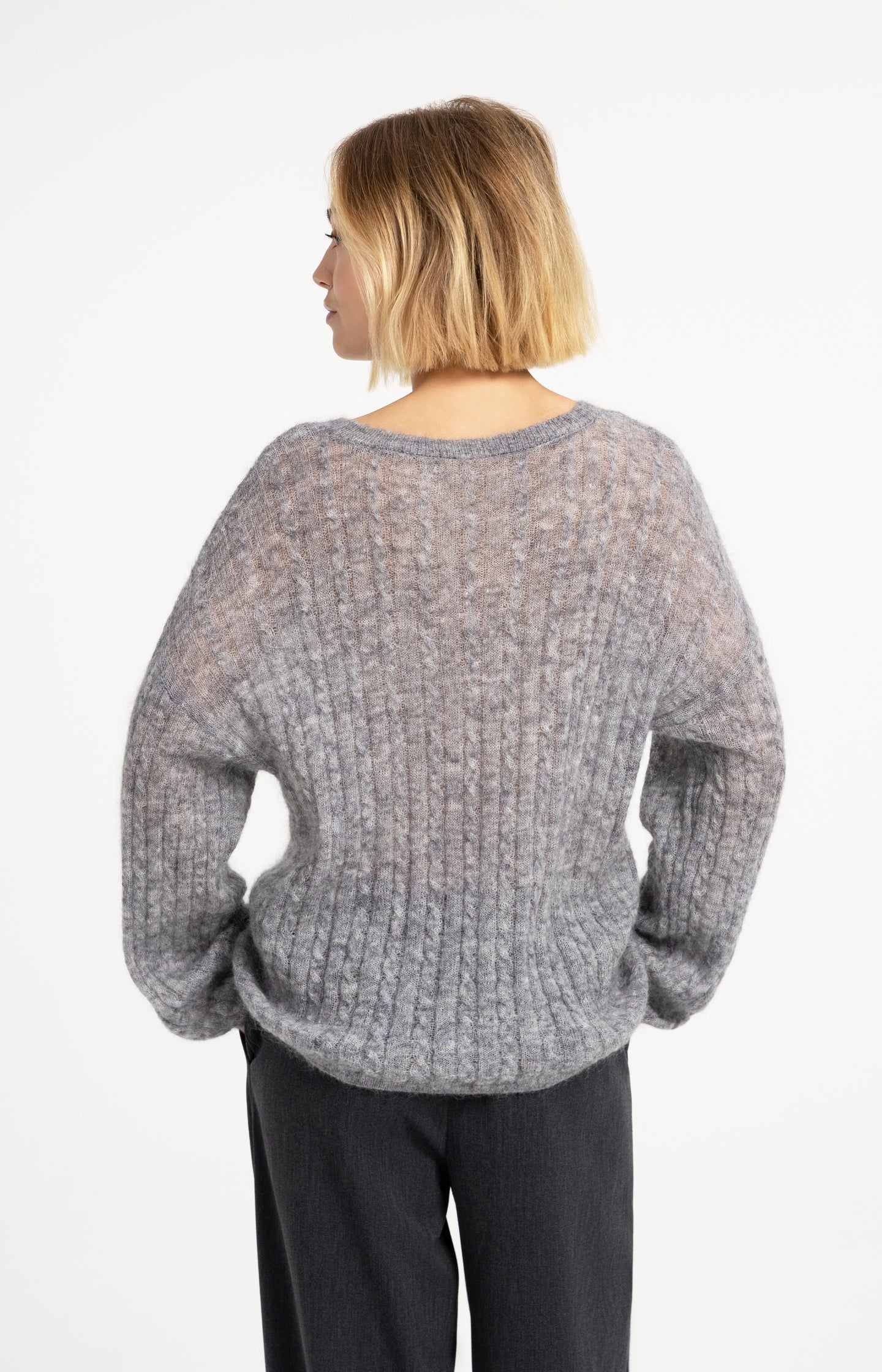 Oversized cable sweater with boat neckline